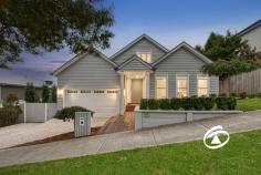  15 Axnick Rise Officer VIC 3809 $1,180,000 - $1,280,000 Elegant. Luxurious. Unforgettable. No stone has been left unturned in crafting this breathtaking family home, from its commanding street presence to the impressive backyard retreat. Perched on a generous 700sqm (approx.) allotment, this one-of-a-kind residence offers a thoughtfully designed floor plan that blends elegance with functionality. Step inside, and you'll immediately be captivated by soaring ceilings and a wide, inviting hallway that sets the stage for the sophistication within. A formal living room provides a peaceful space to unwind before moving into the heart of the home—a stunning open-plan kitchen, dining, and family zone. The kitchen is an entertainer’s dream, featuring premium stone benchtops, soft-close drawers, a tiled splashback, top-tier appliances, and an enormous butler’s pantry. Smart storage solutions include a walk-in linen cupboard with a hidden storage area, perfect for a cellar or extra pantry space. Four spacious bedrooms provide built-in robes, with the primary suite offering a private retreat complete with a luxurious ensuite featuring a double vanity and a walk-through wardrobe. The family bathroom mirrors the same attention to detail, highlighted by a sleek freestanding bath. Multiple living spaces offer versatility for every occasion, including an upstairs retreat with panoramic views, a study nook, and electric skylights that enhance natural light throughout the day. The oversized garage is equally impressive, with soaring ceilings, additional storage under the stairs, and internal access. Side access adds practicality, with ample space for a caravan, boat, or trailer. Outdoors, an expansive deck creates the perfect setting for alfresco dining and entertaining while enjoying breathtaking views. Perfectly positioned on the hilltop opposite Hicks Reserve, this home is just moments from parks, cafés, schools, public transport, and the M1. Built by renowned builder Smarthomes and featuring an array of premium upgrades, this property delivers the ultimate lifestyle package. Inspect today to experience it for yourself! 