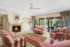  296 The Ridgeway Lisarow NSW 2250 $2,500,000 Spanning approx. 10.9 acres, this inspired estate embodies peace and privacy, welcoming you through a long driveway to one of the Coast’s most captivating homes. Designed by acclaimed architect Edward Alexander, this stunning residence seamlessly blends historical influences with contemporary luxury. Drawing inspiration from the esteemed English architect Edwin Lutyens, many of the home’s distinctive features—from the intricate square lattice windows to the corbelled brickwork—pay homage to Lutyens’ mastery of space and design. Spread across three levels, this masterfully crafted home offers expansive living spaces, including four generous bedrooms, two additional studies and/or bedrooms, and multiple living areas perfect for relaxation and entertainment. The master suite comes complete with a walk-in robe and ensuite, providing a private sanctuary within the home. The home’s artistic touches continue outdoors with a stunning architecturally designed swimming pool, complementing the curve of the landscape, and a charming alfresco entertaining area that opens to sweeping acreage vistas. The kitchen is a culinary haven, featuring stone benchtops, a combustion fireplace, and an effortless connection to the outdoor entertaining spaces. This property is also home to an original two-bedroom cottage (circa 1912), recently upgraded to offer fresh modern living and fully equipped with own parking, fenced yard, and fruit orchard. Showcasing a magnificent fusion of inspired architectural design, indulgent luxury, and beautiful natural scenery, this breathtaking estate is a rare treasure in today’s market. Features include: – Breathtaking 4.42 ha/10.9 acre block perfectly situated within a sought-after acreage region of the Central Coast; stunningly scenic and completely private whilst being within easy reach of every lifestyle convenience and attraction.  – Statement main residence showcasing an inspired architectural design spread across three levels, drawing on acclaimed historical influences to create a truly unique multi-family oasis.  – Panoramic views from each level, looking out across rolling green grounds to the tranquil rainforest and stunning mountains beyond. – Gourmet kitchen complete with gleaming stone countertops, gas cooking facilities, and an island breakfast bar, perfectly positioned to open out to the family meals area with a cosy combustion fireplace before spilling out to an undercover al fresco entertaining area.  – Multiple formal and informal living and entertaining zones to choose from. – Master suite with own ensuite bathroom + walk-in robe. – Three additional, robed bedrooms – all taking in uniquely captivating views and serviced by a newly updated family bathroom following a clever three-way design. – Two separate, dedicated studies – ideal for twin work-from-home scenarios or optional extra bedrooms depending on your requirements.  – Covered al fresco entertaining zone opening out to level green lawns – a superb space to relax and entertain in style. – Sparkling resort-style swimming pool taking in immersive acreage views. – Airy artists studio – a versatile space for creative projects or guest accommodation. – Oversized four-car garage + additional off-street parking for multiple vehicles. – All designed by local architect Edward Alexander, drawing on the work of renowned British architect Edwin Lutyens, and built by master builders Neville Bodycote and Chick Kerr. – Separately positioned, original two-bedroom cottage (circa 1912), beautifully upgraded to offer modern, self-contained living with a single lock-up garage and adjoining fenced yard + thriving fruit orchard.  Extras include: NBN (fixed wireless), tank water, 6 x 20,000 litre water tanks (house) + 1 x 10,000 litre water tank (cottage), septic system. This unique coastal enclave has significant historical value and a multi-faceted past, which will be a delight to discover, while Lisarow itself continues to be a highly sought-after suburb. This prized address is well connected to a full suite of local amenities, including shops, cafes, and schools, while a 15-minute drive connects you to beaches, national parks, and buzzing lifestyle precincts. All just 45 minutes to Wahroonga for effortless access to Sydney and surrounds.  
