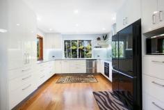  22 Friesian Court Tallebudgera QLD 4228 $2,000,000 This private paradise is an irresistible haven for those seeking a serene and spacious retreat. Occupying 1.75 peaceful acres, a landscape of towering trees and open greenery is accentuated by a meandering creek, with the delightful double-storey home positioned to bask in all this natural beauty. Set well back from the street in a prime, elevated perch, the owners have left no stone unturned here. Beautifully presented, gleaming timber floors flow throughout the top floor, complemented by a modern kitchen with servery window and an open plan living and dining area. This space seamlessly connects to an expansive wraparound deck, where you can savour views of the sprawling greenery and sun-soaked pool or entertain guests in style. Upstairs, three light-filled bedrooms feature, with the master suite boasting a spa ensuite. A brand new internal staircase links with the lower level, hosting two additional bedrooms and bathrooms, an office / potential third bedroom, kitchenette, and a living room – an enticing extra for those seeking a dual living opportunity. Outdoors, after you've explored the natural wonderland setting, refresh yourself in the supersized saltwater pool. Trimmed with a vast sun terrace, it's another idyllic place to retreat and relax. Additional features of the property include a second undercover entertaining area, 11kW solar system, and parking for seven vehicles via two double carports and triple bay shed. Despite being a secluded sanctuary, enjoy the convenience of being only minutes away from Tallebudgera State School and the iconic Man on the Bike pizzeria. And if you're a beach lover, Burleigh's famed sand and surf are just 12 minutes away. Experience the tranquillity and quality first-hand – arrange an inspection today! House Features: Delightful double-storey home in an elevated position, capturing idyllic, tree-lined views Steeped in serenity and set well back from the street Gleaming timber floors throughout plus a brand new internal staircase Modern, spacious kitchen with a servery window to the outdoor entertaining area Open plan living and dining area seamlessly connects with the wraparound deck Five generously sized bedrooms serviced by four renovated bathrooms (includes master suite with a spa ensuite) Dual living opportunity, with a downstairs kitchenette and living room alongside two of the bedrooms and bathrooms A ground floor office with the potential to be converted into a third bedroom by simply adding a door. Expansive wrap-around verandah with servery window and bar, overlooks the sprawling greenery and pool Stunning 13m x 7m (approx.) saltwater pool with new chlorinator, trimmed in a vast sun-terrace Wraparound undercover patio Double carport Updated with new LED lights, built-in robes (to bedrooms) split system air-conditioning units and fans Four camera security system 6 speaker music system Storeroom Property Features: Supremely peaceful and private 7086m2 block Landscape accentuated by a meandering creek, towering trees and open greenery 11.8m x 6m 3-bay shed 3.2m x 3.2m shed 11kW solar system Instant hot water - 4 gas bottles Solar sensor lights Abundant parking Two water tanks (irrigation only) Envirocycle Rooftop dish Location: Approx. 3 mins to Tallebudgera State School, local shops and eateries Approx. 5 mins to Coplick Family Sports Park Approx. 6 mins to St Andrews Lutheran College Approx. 12 mins to Burleigh Heads Approx. 14 mins to Palm Beach Approx. 16 mins to Currumbin Beach Approx. 21 mins to Gold Coast Airport Approx. 36 mins to Surfers Paradise Disclaimer: Whilst every effort has been made to 