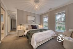  15 Axnick Rise Officer VIC 3809 $1,180,000 - $1,280,000 Elegant. Luxurious. Unforgettable. No stone has been left unturned in crafting this breathtaking family home, from its commanding street presence to the impressive backyard retreat. Perched on a generous 700sqm (approx.) allotment, this one-of-a-kind residence offers a thoughtfully designed floor plan that blends elegance with functionality. Step inside, and you'll immediately be captivated by soaring ceilings and a wide, inviting hallway that sets the stage for the sophistication within. A formal living room provides a peaceful space to unwind before moving into the heart of the home—a stunning open-plan kitchen, dining, and family zone. The kitchen is an entertainer’s dream, featuring premium stone benchtops, soft-close drawers, a tiled splashback, top-tier appliances, and an enormous butler’s pantry. Smart storage solutions include a walk-in linen cupboard with a hidden storage area, perfect for a cellar or extra pantry space. Four spacious bedrooms provide built-in robes, with the primary suite offering a private retreat complete with a luxurious ensuite featuring a double vanity and a walk-through wardrobe. The family bathroom mirrors the same attention to detail, highlighted by a sleek freestanding bath. Multiple living spaces offer versatility for every occasion, including an upstairs retreat with panoramic views, a study nook, and electric skylights that enhance natural light throughout the day. The oversized garage is equally impressive, with soaring ceilings, additional storage under the stairs, and internal access. Side access adds practicality, with ample space for a caravan, boat, or trailer. Outdoors, an expansive deck creates the perfect setting for alfresco dining and entertaining while enjoying breathtaking views. Perfectly positioned on the hilltop opposite Hicks Reserve, this home is just moments from parks, cafés, schools, public transport, and the M1. Built by renowned builder Smarthomes and featuring an array of premium upgrades, this property delivers the ultimate lifestyle package. Inspect today to experience it for yourself! 