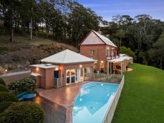  296 The Ridgeway Lisarow NSW 2250 $2,500,000 Spanning approx. 10.9 acres, this inspired estate embodies peace and privacy, welcoming you through a long driveway to one of the Coast’s most captivating homes. Designed by acclaimed architect Edward Alexander, this stunning residence seamlessly blends historical influences with contemporary luxury. Drawing inspiration from the esteemed English architect Edwin Lutyens, many of the home’s distinctive features—from the intricate square lattice windows to the corbelled brickwork—pay homage to Lutyens’ mastery of space and design. Spread across three levels, this masterfully crafted home offers expansive living spaces, including four generous bedrooms, two additional studies and/or bedrooms, and multiple living areas perfect for relaxation and entertainment. The master suite comes complete with a walk-in robe and ensuite, providing a private sanctuary within the home. The home’s artistic touches continue outdoors with a stunning architecturally designed swimming pool, complementing the curve of the landscape, and a charming alfresco entertaining area that opens to sweeping acreage vistas. The kitchen is a culinary haven, featuring stone benchtops, a combustion fireplace, and an effortless connection to the outdoor entertaining spaces. This property is also home to an original two-bedroom cottage (circa 1912), recently upgraded to offer fresh modern living and fully equipped with own parking, fenced yard, and fruit orchard. Showcasing a magnificent fusion of inspired architectural design, indulgent luxury, and beautiful natural scenery, this breathtaking estate is a rare treasure in today’s market. Features include: – Breathtaking 4.42 ha/10.9 acre block perfectly situated within a sought-after acreage region of the Central Coast; stunningly scenic and completely private whilst being within easy reach of every lifestyle convenience and attraction.  – Statement main residence showcasing an inspired architectural design spread across three levels, drawing on acclaimed historical influences to create a truly unique multi-family oasis.  – Panoramic views from each level, looking out across rolling green grounds to the tranquil rainforest and stunning mountains beyond. – Gourmet kitchen complete with gleaming stone countertops, gas cooking facilities, and an island breakfast bar, perfectly positioned to open out to the family meals area with a cosy combustion fireplace before spilling out to an undercover al fresco entertaining area.  – Multiple formal and informal living and entertaining zones to choose from. – Master suite with own ensuite bathroom + walk-in robe. – Three additional, robed bedrooms – all taking in uniquely captivating views and serviced by a newly updated family bathroom following a clever three-way design. – Two separate, dedicated studies – ideal for twin work-from-home scenarios or optional extra bedrooms depending on your requirements.  – Covered al fresco entertaining zone opening out to level green lawns – a superb space to relax and entertain in style. – Sparkling resort-style swimming pool taking in immersive acreage views. – Airy artists studio – a versatile space for creative projects or guest accommodation. – Oversized four-car garage + additional off-street parking for multiple vehicles. – All designed by local architect Edward Alexander, drawing on the work of renowned British architect Edwin Lutyens, and built by master builders Neville Bodycote and Chick Kerr. – Separately positioned, original two-bedroom cottage (circa 1912), beautifully upgraded to offer modern, self-contained living with a single lock-up garage and adjoining fenced yard + thriving fruit orchard.  Extras include: NBN (fixed wireless), tank water, 6 x 20,000 litre water tanks (house) + 1 x 10,000 litre water tank (cottage), septic system. This unique coastal enclave has significant historical value and a multi-faceted past, which will be a delight to discover, while Lisarow itself continues to be a highly sought-after suburb. This prized address is well connected to a full suite of local amenities, including shops, cafes, and schools, while a 15-minute drive connects you to beaches, national parks, and buzzing lifestyle precincts. All just 45 minutes to Wahroonga for effortless access to Sydney and surrounds.  