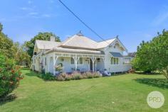 32 Milner Parade Quirindi NSW 2343 $675,000 to $695,000 This majestic Federation-style residence at 32 Milner Parade, Quirindi, NSW, is not merely a home-it's a cherished heritage icon within the Liverpool Plains region. Crafted by Mr. Robert Pollock, the artisan behind some of the town's earliest significant structures, such as the original General Store, this property is rich in local history and presents a unique opportunity to own a fragment of Quirindi's architectural heritage. Built in the vicinity of 1912, during the Federation era, the house exhibits the period's signature features, including 12-foot-high ceilings and detailed pressed metal walls and ceilings. It has been lovingly updated to accommodate modern family living, featuring three bedrooms and an additional sleep-out or office space. Set on a spacious 3,097-square-meter plot with three titles, West Lynne offers an elegant entry hall, a formal lounge with fireplace, and a north-facing enclosed veranda for all-season comfort. The master bedroom is complemented by an ensuite, while the expansive kitchen-dining area, equipped with electric oven, gas cooktop, and wood stove, opens to a breezy rear deck, merging tradition with function. The property also includes a single-car garage, a five-bay machinery shed, and a workshop, adding versatility. As a designated heritage site, this residence serves as a sanctuary and a testament to the area's history, perfect for those eager to preserve a part of Quirindi's past while savoring a charming, practical space with picturesque views. Located just two minutes (less than 3km) from town, step into this timeless treasure where each room narrates its story, and each sunset becomes your cherished memory-this heritage home awaits someone to appreciate it as deeply as it cherishes its legacy. 