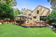  105 Lake Shore Dr North Avoca NSW 2260 This remarkable residence is a testament to both spacious living and impeccable design, seamlessly blending modern sophistication with timeless charm. A rare find in this coveted coastal enclave, the property sits on an expansive parcel of land and offers self-contained accommodation. Precisely renovated to enhance both style and functionality, this home is an oasis of tranquilly, offering the perfect balance of indoor elegance and outdoor serenity. Features include: – Set on 764sqm of meticulously landscaped front and rear gardens, this home offers an abundance of space rarely found in the area. – The light-filled living and dining areas, aired with high vaulted ceilings, exude warmth and sophistication, perfect for both grand entertaining and everyday moments by the cosy log burner. – A dream for culinary enthusiasts, the renovated kitchen boasts premium appliances, stylish cabinetry, and an expansive benchtop. – Featuring four well-appointed bedrooms—three in the main residence and one in the apartment—this home offers flexibility for families, guests, or a private home office. – The master bedroom offers a peaceful loft sanctuary, complete with an ensuite and second living area. – A spacious studio apartment with a beautifully appointed kitchen, a cute bathroom, and an abundance of storage. – An oversized rear deck is accompanied by a beautiful jacuzzi spa, cabana, low-maintenance Astroturf, and a peaceful, natural creek. – With double garaging for multiple vehicles or storage, convenience is at the forefront of this home’s design. Positioned just moments from the pristine beaches of North Avoca, vibrant cafés, and scenic lagoon walking trails, it promises an enviable lifestyle tailored to families and entertainers alike. 