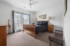  1/428 McClelland Drive Langwarrin VIC 3910 $699,000 - $749,000 Stacked with high-end finishes, clever storage, and a layout that just makes sense, this modern 3-bedroom townhouse delivers a home that's sleek, stylish, and straight-up effortless. A smart and effortless design that works for living easily has been crafted for maximum flow between indoors and out, ready for lively entertaining, kicking back, or just living your best life. Its open-plan living and dining zone is finished with large-format tiles and equally impressive natural light, filtering golden rays inside while peering out over its covered terrace and yard. The kitchen is a showstopper with warming tones and sleek stone benchtops surrounding stainless steel appliances, stepping outside to a private covered patio ready for morning coffees, sunset drinks, or lazing away. Three generous bedrooms include a downstairs master with a full ensuite and walk-through robe, with individual split-system comforts, a central bathroom and a separate toilet serving the upper level. Comfort is covered year-round with central heating and split-system air conditioning, while the remote double garage stores the wheels. Its location is near-unbeatable, just minutes from Karingal Hub, Mornington Peninsula Freeway, Karingal Heights Primary, McClelland College, and public transport, putting everything you need right at your fingertips. Whether you're a first-home buyer, a savvy investor, or looking to downsize without compromise, this one ticks every single box.  