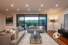  5 Rutland Rd Berwick VIC 3806 $1,650,000 - $1,750,000 Individually designed with exceptional attention to detail, this stunning contemporary residence is a masterpiece of style, comfort, and functionality. Set in one of Berwick Village’s most coveted locations, it offers the perfect balance of modern luxury and everyday convenience, just a short stroll from vibrant cafés, restaurants, and boutique shops. Principally set on one expansive level, this home boasts a thoughtfully designed floorplan, complemented by premium finishes throughout. Richly coloured Ironbark timber floors flow seamlessly underfoot, while a striking slumped glass feature window adds a dramatic touch to the open-plan living area. Floor-to-ceiling glass doors extend the space outdoors, seamlessly connecting the interior to an impressive covered alfresco deck. Here, you can entertain in style or unwind in tranquility while soaking in the breathtaking elevated views of Berwick’s picturesque landscape. At the heart of the home, the sleek and sophisticated kitchen is a chef’s dream. It features glass-topped benches, stunning Biltmore Cherry cabinetry, stainless steel appliances, and an abundance of storage—combining practicality with high-end appeal. The expansive living and dining areas are thoughtfully divided by custom-built cabinetry, creating the perfect space for relaxation and entertainment. The main level accommodates three spacious bedrooms, each with extensive built-in storage. The luxurious master suite boasts a walk-in robe and a private ensuite designed for indulgence. A generous home office provides the perfect work-from-home space, catering to modern lifestyles. On the lower level, a private guest suite with its own ensuite offers an ideal retreat for visitors or extended family. Adding to the home’s exceptional features is a fully fitted theatre room, complete a stylish wet bar—creating the ultimate in-home movie experience. Outside, beautifully landscaped gardens frame a second paved and covered BBQ area, extending onto private rear lawns. An oversized double garage with rear trailer access is complemented by extensive under-house storage, including a 25,000-litre rainwater tank. Comfort is assured year-round with hydronic panel heating, air conditioning, and energy-efficient 'smart glass' that enhances climate control. This exceptional home is an unparalleled opportunity to secure a modern sanctuary in an elite location—offering effortless access to the heart of Berwick Village and its renowned lifestyle amenities. 