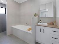  70 Bedford Road ANDERGROVE QLD 4740 Discover modern living at its finest with this newly built executive-style residence, meticulously designed to accommodate the evolving needs of a growing family. Offering four spacious bedrooms and a versatile media room that can serve as a fifth bedroom, this property is a must-see. Upon entry, you're welcomed into a thoughtfully planned interior. The contemporary kitchen is a chef's delight, featuring all modern appliances, abundant bench and storage space, and a built-in butler's pantry. This culinary hub seamlessly connects to the dining and living areas, which opens out to a generous outdoor entertainment space-ideal for family gatherings and enjoying sunny days. Comfort is assured with full air-conditioning throughout the home. The family bathroom is well-appointed, offering a separate shower and bathtub, with an independent toilet for added convenience. The master bedroom, situated at the front of the house, boasts a walk-in wardrobe and a private ensuite. The additional three bedrooms are strategically placed throughout the home, each equipped with built-in wardrobes. Set on an expansive 1,012m² allotment, the property is fully fenced and provides double-gate side access to the rear yard. This layout offers ample opportunity to add a substantial shed or a swimming pool, all while retaining plenty of open space. The double-car garage with internal access enhances daily convenience. With over 11kw solar panels installed to reduce living costs, and prime Starlink satellite, and modem this property presents a fantastic opportunity to secure a modern and high tech, energy-efficient home in a prime location. Positioned in close proximity to Andergrove's supermarkets, restaurants, parks, medical facilities, and the wake park, primary and secondary schools this home also benefits from being just a five-minute drive to the Mackay CBD. This property represents a unique opportunity to secure a modern, family-friendly home in a sought-after location. 