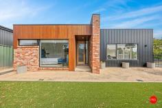  2 Rheola Drive White Hills VIC 3550 $795,000 - $850,000 Welcome to 2 Rheola Road, White Hills - an HIA award winning home that combines modern luxury with effortless family living. This stunning ex-Sandhurst display home, which won Best Display Home, presents the perfect opportunity to upsize into a stylish, low-maintenance property, offering everything you need to live stylishly in modern surrounds. Located just 5 minutes from the Bendigo CBD and a short 4-minute drive to the beautiful Bendigo Botanic Gardens, you're positioned in a prime location that provides both convenience and tranquility. Whether you're commuting, shopping, or enjoying a leisurely afternoon in the gardens, everything is at your doorstep. Entering onto spectacular polished concrete floors, the entry leads you to the aesthetic heart of the home with 3m high soaring ceilings. The contemporary matte black kitchen is a standout with its sleek 900mm appliances, built in appliance cupboard, standalone double pantry, 40mm stone benchtops and feature stone splashback. An impressive extra walk-in pantry fitted out with custom joinery and matching stone tops gives the kitchen a superb prep space. The 3.0-meter-high ceilings through the main living areas of the house elevate the sense of space and openness, giving the entertaining spaces, rear bedrooms and bathroom a soaring sense of grandeur and natural light pours in through the triple skylights above. The master suite is nothing short of luxurious, with luxury carpets, a crafted joiner-built walk in robe and generous ensuite featuring his and her basins and his and her open showers. A freestanding bath is ideal for relaxing after a long day. For added versatility, the home features a second lounge room, ideal for a kids' playroom or a quiet retreat for the adults. Throughout the home, you'll find expansive storage solutions, keeping your space organised and clutter-free. Ducted gas heating and cassette cooling ensure year-round comfort, no matter the season. The stunning main bathroom, with its opulent circular tub and floor-to-ceiling tiles, adds a touch of elegance to this already exquisite home. The laundry features abundant built-in joinery, whilst bedrooms 2, 3, and 4 are all spacious and equipped with built-in robes, all punctuated by those amazing 3m high ceilings. The north facing alfresco features a beautiful merbau deck and the garden is fully established and low maintenance, with auto irrigation and artificial turf allowing you to sit back and simply enjoy the stunning landscaping. The garage is currently converted to a rumpus room/office space with private WC, a great addition if you wish to work from home or need that extra living area. Or if preferred, the seller will swap out the large glass sliding door for a garage door at no cost. There is rear street access available if you'd prefer to park directly in the back yard. With its blend of architectural design, spacious living areas, and premium features, this home is the perfect place to create lasting memories with your family. Whether you're relaxing at home or exploring all that Bendigo has to offer, 2 Rheola Drive is the ideal setting for your new lifestyle. 