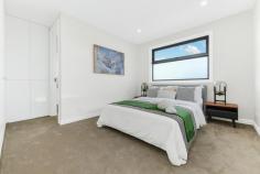  3/4 Medway Street Box Hill North VIC 3129 $1,600,000-$1,700,000 This brand-new dual-level townhouse is a meticulously designed, contemporary offering in one of Box Hill North's most sought-after locations. Just minutes from Box Hill Central's vibrant retail, dining and entertainment precinct, the home is also within walking distance of parks, childcare centres and local employment zones. Zoned for Kerrimuir Primary School and Box Hill High School, it's also perfectly positioned near public transport options. Designed with modern industrial inspiration, the home's striking facade combines textured brickwork with smooth render, creating a bold sophisticated aesthetic. The statement entryway, featuring a recessed porch and oversized timber door, offers a grand yet understated welcome. The black panel-lift garage door integrates into the design. Stunning 2.7m square-set ceilings enhance the sense of space, while opulent herringbone timber flooring flows throughout. The open-plan design is filled with natural light and large black-trimmed glass sliding doors open to a private courtyard. A centrally controlled zoned heating and cooling system ensures year-round comfort, while modern LED downlights illuminate. The ground-floor guest bedroom is a retreat, complete with a study and private ensuite. An external storage shed adds practicality. The decadent kitchen blends industrial chic with refined luxury. A four-seater breakfast island with 60mm marble-look stone, waterfall edging and feature v-panel backboards sits beneath striking black pendant lights. The splashback matches the stone benchtops while a matte-black double bowl sink with a gooseneck flick mixer is sophisticated. Finger-pull gloss white cabinetry and drawers provide storage, while quality 600mm appliances, including a gas burner cooktop, oven and dishwasher, cater to the needs of modern living. A spacious butler's pantry extends the kitchen's functionality, offering additional stone countertops, an extra sink and a second stove. Upstairs, three oversized bedrooms branch off a sunlit retreat, each with generous robe storage and ensuites. The bathrooms are luxurious, featuring floor-to-ceiling wall tiles, vanities with 60mm marble-look stone, avant-garde sink and tapware and fully frameless showers with dual shower heads and niche shelving. The main bedroom's ensuite adds an indulgent freestanding bathtub. Property Highlights: • Brand-new townhouse with high-end finishes • High ceilings, herringbone timber flooring and zoned AC • 60mm stone, quality appliances,butler's pantry 