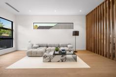  1/18 Broughton Road Surrey Hills VIC 3127 $2,000,000-$2,200,000 Welcome to 1/18 Broughton Road, a beautifully designed townhouse that perfectly blends modern architecture with urban living. This exquisite property offers a luxurious lifestyle with its spacious interiors, stylish finishes, and an unbeatable location in the heart of Surrey Hills. Property Features: - Bedrooms: 4 generously sized bedrooms, each designed with comfort and style in mind. The master suite features an elegant chandelier and ample natural light, creating a serene retreat. - Bathrooms: 3 modern bathrooms equipped with high-end fixtures, ensuring a spa-like experience at home. Enjoy the convenience and luxury of well-appointed spaces for relaxation. - Garage: Double garage spaces provide secure parking and additional storage, a rare find in urban settings. - Living Spaces: The open-plan living and dining area is perfect for entertaining, featuring stunning flooring and an inviting ambiance. The living room, adorned with tasteful decor and a cozy coffee table, flows seamlessly into the dining area, making it ideal for gatherings with family and friends. - Kitchen: The gourmet kitchen boasts modern appliances, ample counter space, and stylish cabinetry, making it a chef's dream. Prepare meals while enjoying views of the beautifully landscaped lawn through large windows. - Outdoor Area: Step outside to your private porch and lush grass area, perfect for alfresco dining or enjoying a morning coffee surrounded by nature. - Interior Design: Every corner of this home is thoughtfully designed, from the foyer that welcomes you with warmth to the carefully selected furniture and decor that enhance the overall aesthetic. -Neighborhood: Located in a vibrant community, this townhouse is just moments away from local cafes, parks, and shopping, offering the perfect blend of convenience and tranquility. Enjoy the best of urban living while being surrounded by beautiful greenery. 