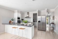  11 Rennison Drive Botanic Ridge VIC 3977 $940,000 - $1,005,000 Big, bold, and built for a lifetime of family memories, this 4-bedroom, 3-lounge home delivers modern style in spaces, more space than you'll know what to do with, and the flexibility to make it truly yours - because a forever home should fit your life, not the other way around. Step beyond the threshold and feel the freedom of its expansive layout, with glossy tiles leading past a formal lounge to a massive open-plan family, dining, and kitchen area. Top-tier appliances fit a kitchen and butler's pantry that defies all previous standards of space, adjoining a fireside rumpus/media room and a full-width indoor-outdoor terrace, perfect for weekend BBQs, wine nights, or just watching the kids go wild in the backyard. When it's time to unwind, the main suite is pure luxury with his & her robes, plus a twin-vanity ensuite, with three more bedrooms around a sleek bathroom, separate toilet, and full-sized laundry. Style matches functionality with evaporative cooling, ducted heating, premium blinds, solar power, and an impressive double garage with additional length for the home handyman or DIY enthusiast. Mere steps from Station Creek Playground and only moments to Cranbourne South Primary, Botanic Ridge Village and Cranbourne West shopping, and some of the state's best golfing at Settler's Run and Ranfurlie, this home is all about big families with big dreams.  