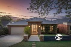  5 Rutland Rd Berwick VIC 3806 $1,650,000 - $1,750,000 Individually designed with exceptional attention to detail, this stunning contemporary residence is a masterpiece of style, comfort, and functionality. Set in one of Berwick Village’s most coveted locations, it offers the perfect balance of modern luxury and everyday convenience, just a short stroll from vibrant cafés, restaurants, and boutique shops. Principally set on one expansive level, this home boasts a thoughtfully designed floorplan, complemented by premium finishes throughout. Richly coloured Ironbark timber floors flow seamlessly underfoot, while a striking slumped glass feature window adds a dramatic touch to the open-plan living area. Floor-to-ceiling glass doors extend the space outdoors, seamlessly connecting the interior to an impressive covered alfresco deck. Here, you can entertain in style or unwind in tranquility while soaking in the breathtaking elevated views of Berwick’s picturesque landscape. At the heart of the home, the sleek and sophisticated kitchen is a chef’s dream. It features glass-topped benches, stunning Biltmore Cherry cabinetry, stainless steel appliances, and an abundance of storage—combining practicality with high-end appeal. The expansive living and dining areas are thoughtfully divided by custom-built cabinetry, creating the perfect space for relaxation and entertainment. The main level accommodates three spacious bedrooms, each with extensive built-in storage. The luxurious master suite boasts a walk-in robe and a private ensuite designed for indulgence. A generous home office provides the perfect work-from-home space, catering to modern lifestyles. On the lower level, a private guest suite with its own ensuite offers an ideal retreat for visitors or extended family. Adding to the home’s exceptional features is a fully fitted theatre room, complete a stylish wet bar—creating the ultimate in-home movie experience. Outside, beautifully landscaped gardens frame a second paved and covered BBQ area, extending onto private rear lawns. An oversized double garage with rear trailer access is complemented by extensive under-house storage, including a 25,000-litre rainwater tank. Comfort is assured year-round with hydronic panel heating, air conditioning, and energy-efficient 'smart glass' that enhances climate control. This exceptional home is an unparalleled opportunity to secure a modern sanctuary in an elite location—offering effortless access to the heart of Berwick Village and its renowned lifestyle amenities. 