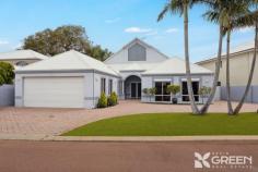  4 Carnarvon Way Erskine WA 6210 $949,000 Nestled in the prestigious Mandurah Quays Estate, this thoughtfully designed home offers charm, prestige, and an unbeatable lifestyle. From the moment you step through the double front doors, you’ll be captivated by the impressive entrance hall, featuring a soaring gable ceiling and a stunning feature staircase. Built in 2000, this home is perfect for buyers seeking something truly special. Whether you’re looking for space, elegance, or breathtaking lake views, this property delivers. Downstairs, you’ll enjoy: • A luxurious master suite with an ensuite and walk-through his-and-hers robe. • A light-filled open-plan kitchen and dining area that maximizes stunning lake views. • A sunken lounge/living area, ideal for relaxation. • A second separate sunken lounge/theatre, perfect for movie nights. • A large study or optional 4th bedroom. • A powder room, laundry, and a functional mudroom. Upstairs, the home features: • Two queen-sized bedrooms, each with double robes and split system air conditioning. • A spacious main bathroom with a corner bath, shower, vanity, and floor-to-ceiling tiles. • A TV/study nook and convenient attic storage. • A separate WC and additional linen storage. Outdoor Entertaining and Low-Maintenance Living Designed for effortless entertaining, the large alfresco area offers tranquil water views and is fitted with café blinds for year-round enjoyment. Low-maintenance artificial turf enhances both the front and back yards, making this property an ideal lock-and-leave option. Other standout features include: • Paved side access with space for a boat and/or caravan. • Extra-large double garage with high ceilings. • Workshop/storage/mudroom. • Ducted reverse-cycle air conditioning. • Alarm system, roller shutters, and 11 solar panels. • Two instant gas hot water systems. Unbeatable Location Situated just a 2-minute walk to the marina and a 5-minute stroll to Boundary Island Brewery, you’ll love the ease of dining out and enjoying waterfront living.  