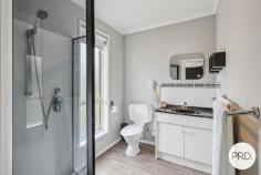  8 Radiata Drive Lindisfarne TAS 7015 $948,000 If you have been searching for a large family home with enough floor space so everyone is not walking over each other, then this 271sqm residence set on a 1271sqm block is probably just what you and your family need. With 6 bedrooms, all with built in robes, 2 bathrooms, separate powder room, separate laundry, 3 separate living rooms, 2 balconies, 1 deck, a gazebo, workshop and double garage, there are plenty of places for the children to play hide and seek. Both levels have reverse cycle air conditioners and there are also other heaters inside keeping the home warm all year round. The kitchen has just been modernised with new doors and drawers. It forms the centre of this home's meals and activities, and this part of the upstairs takes in relaxing north easterly views of hillsides and neighbouring suburbs. As for the street itself, it's a quiet cul-de-sac with other large family homes nearby. This location is seen as ideal, close to: private and public schools; Eastlands Shopping centre; public transport; medical facilities; sporting venues; a major hardware store; parks; TasTafe Clarence Campus and has easy access to the Tasman Highway. The garden area is large and has pear, banana passionfruit, grapes, lime and lemons but if you wish to increase the number of fruit trees, shrubs and vegetables then there is more than enough room to do so. The yard is secure and ideal for pets and children to play. Outside entertaining is made simple with 4 separate areas where you can sit outside in our warmer summer months and take in the fresh air whilst eating and/or sipping on your favourite beverages. Off street parking is also well catered for with a tandem garage and room for other vehicles. Loads of storage is located under the house with a separate storage room and a workshop/storage area adjacent to the garage. And for your added safety and peace of mind, you will find a camera surveillance and alarm system. 
