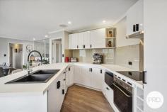  8 Radiata Drive Lindisfarne TAS 7015 $948,000 If you have been searching for a large family home with enough floor space so everyone is not walking over each other, then this 271sqm residence set on a 1271sqm block is probably just what you and your family need. With 6 bedrooms, all with built in robes, 2 bathrooms, separate powder room, separate laundry, 3 separate living rooms, 2 balconies, 1 deck, a gazebo, workshop and double garage, there are plenty of places for the children to play hide and seek. Both levels have reverse cycle air conditioners and there are also other heaters inside keeping the home warm all year round. The kitchen has just been modernised with new doors and drawers. It forms the centre of this home's meals and activities, and this part of the upstairs takes in relaxing north easterly views of hillsides and neighbouring suburbs. As for the street itself, it's a quiet cul-de-sac with other large family homes nearby. This location is seen as ideal, close to: private and public schools; Eastlands Shopping centre; public transport; medical facilities; sporting venues; a major hardware store; parks; TasTafe Clarence Campus and has easy access to the Tasman Highway. The garden area is large and has pear, banana passionfruit, grapes, lime and lemons but if you wish to increase the number of fruit trees, shrubs and vegetables then there is more than enough room to do so. The yard is secure and ideal for pets and children to play. Outside entertaining is made simple with 4 separate areas where you can sit outside in our warmer summer months and take in the fresh air whilst eating and/or sipping on your favourite beverages. Off street parking is also well catered for with a tandem garage and room for other vehicles. Loads of storage is located under the house with a separate storage room and a workshop/storage area adjacent to the garage. And for your added safety and peace of mind, you will find a camera surveillance and alarm system. 