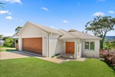  18 Kirala Avenue Mangerton NSW 2500 Nestled in the heart of Mangerton, this spacious five-bedroom home offers the perfect blend of warmth, character, and resort-style luxury, making an unforgettable first impression. Designed with flexibility in mind, the home unfolds across two generous levels, ensuring every family member has the space they need to relax and connect. Five well-proportioned bedrooms, including three with walk-in wardrobes, provide a private retreat for all, while ducted air conditioning and Brushbox hardwood flooring add year-round comfort. Upstairs, the formal living and dining area seamlessly flows into a sleek kitchen with stone bench tops and electric cooktop, where breathtaking escarpment views create the perfect backdrop for culinary creations. Downstairs, a second living area offers the ideal escape for movie nights and kids' playtime with two bedrooms ideal for guests or multi-generational living. With three distinct outdoor zones, entertaining takes centre stage. Whether it's a casual weekend barbecue, a twilight dinner under the stars, or a lazy afternoon by the sparkling in-ground pool, there's a space for every occasion, making it the ultimate sanctuary for modern family living. Five bedrooms, three with walk-in-wardrobes Three outdoor living areas, in-ground pool with solar Two indoor living areas, escarpment views Ducted a/c, Brushbox hardwood flooring, lock-up garage Neutral interiors ready for your personal touch 