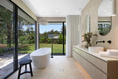  457 Tallebudgera Creek Road Tallebudgera Valley QLD 4228 $5,999,000 Welcome to "Willow Park," an extraordinary private sanctuary where contemporary luxury meets serene natural beauty. Nestled on an expansive and level 1.86-acre estate with direct frontage to the picturesque Tallebudgera Creek, this newly built residence is a masterpiece of modern design, offering a lifestyle of unparalleled tranquillity and sophistication. From the moment you arrive, an oversized glass entryway framed by a striking stone feature wall and elegant chandelier sets the tone for the grandeur that lies within. Beyond the welcoming foyer, the heart of the home unfolds into an expansive open-plan living, dining, and kitchen area, crowned by soaring cathedral ceilings with VJ panelling. Designed to embrace natural light and breath-taking views, floor-to-ceiling windows and a dramatic stone-clad feature wall create an atmosphere of refined opulence. The gourmet kitchen, an entertainer's dream, boasts an oversized island bench, premium Electrolux appliances, a glass splashback, and an integrated dishwasher drawer. A fully equipped butler's pantry with a wine fridge, additional sink, and Miele dishwasher ensures effortless hosting. Meanwhile, five generously proportioned bedrooms, four luxurious bathrooms, and an additional powder room are thoughtfully positioned throughout the home. The master suite, a private retreat in its own wing, is an oasis of indulgence. Overlooking the pool and lush surroundings, it features a custom-designed dressing room with bespoke cabinetry, a beauty station, and an opulent ensuite complete with a freestanding bath, dual vanity, and floor-to-ceiling tiling. Three additional bedrooms include custom built-in robes, with two enjoying the convenience of modern ensuites. A versatile fifth bedroom, ideal as a home office, completes the accommodation. For those who appreciate cinematic experiences, a soundproof media room offers the perfect setting for family movie nights or immersive entertainment. Step outside into an enchanting natural wonderland, where mature trees, manicured lawns, and pristine creek frontage create a breathtaking backdrop. A vast covered timber deck, complete with an outdoor kitchen, sets the stage for unforgettable alfresco gatherings, while the resort-style pool, featuring a diving board and timber decking, invites endless enjoyment. For moments of relaxation, a spa and sun deck await, along with a charming poolside pavilion where you will find the sauna and a separate pool house with barn-style entry and powder room. As the sun sets, gather around the firepit and soak in the peaceful ambience of this unparalleled setting or move to the purpose built creek side deck overlooking the sprawling lawn. Every aspect of this home has been carefully curated for comfort and convenience. State-of-the-art inclusions such as ducted air-conditioning, LED lighting, security alarm and CCTV cameras, Wi-Fi boosters, an electric gated entrance with intercom, and a Yale security system ensure effortless modern living. Sustainable features include a 13.2kW solar system, electric hot water, and town water supply with additional pumping rights from Tallebudgera Creek. Perfectly positioned, "Willow Park" is just minutes from top-tier schools such as Tallebudgera State School and St. Andrews Lutheran College. The iconic beaches of Burleigh Heads, Palm Beach, and Currumbin are within a short drive, offering the best of coastal living, while Gold Coast Airport and Surfers Paradise are also easily accessible. This exceptional residence is a rare opportunity to secure a home of distinction in one of the most sought-after locations. All the hard work has been done—simply move in and immerse yourself in the luxury and serenity of "Willow Park." Arrange your private inspection today and experience the pinnacle of Gold Coast acreage living. - Ducted air-conditioning - LED lighting - Security alarm and CCTV cameras - Wi-Fi boosters - Electric gated entrance with intercom - Yale security system - 13.2kW solar system - Electric hot water - Town water supply with additional pumping rights from Tallebudgera Creek - Property features: - Expansive and level 1.86-acre estate with Tallebudgera Creek frontage - Newly built, architecturally designed home - Oversized glass entryway with a stone feature wall and chandelier - Open-plan living, dining, and kitchen area with cathedral ceilings - Floor-to-ceiling windows and a striking stone-clad feature wall - Gourmet kitchen with an oversized island, premium Electrolux appliances, and glass splashback - Butler's pantry with a wine fridge, sink, and Miele dishwasher - Soundproof media room for immersive entertainment - Five spacious bedrooms, including a master retreat in its own wing - Four luxurious bathrooms plus an additional powder room - Master suite with custom dressing room, beauty station, and spa-like ensuite - Covered timber deck with an outdoor kitchen - Resort-style pool with diving board and timber decking - Spa, sun deck, and poolside pavilion - Firepit area for relaxed evenings outdoors - Pool house with barn-style entry and powder room Location benefits: - Approx. 5 mins to Tallebudgera State School and local shops - Approx. 5 mins to St. Andrews Lutheran College - Approx. 11 mins to Burleigh Heads - Approx. 12 mins to Palm Beach - Approx. 14 mins to Currumbin Beach - Approx. 18 mins to Gold Coast Airport - Approx. 39 mins to Surfers Paradise 