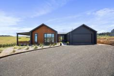  8 Moyne View Little Hartley NSW 2790 $1,450,000 - $1,550,000 This impressive architecturally designed home, completed in 2023, catches your eye from the moment of arrival. Affording an elevated perspective, with Blue Mountain escarpment views and rolling farmland outlooks, this is a home that offers a break from the bustle of city life. It is a haven of light, space and versatility with its contemporary dual-wing design. With a choice of relaxation zones and four bedrooms this home offers flexible functionality. Expansive alfresco entertaining and an enormous 4 car workshop add to this home's modern appeal which is found less than a 2 hour drive from Sydney. This is a chance to live the country lifestyle without compromising on your contemporary checklist. Breakdown of Features: Perfect single level flow with central wide entry giving way to dual wing floorplan Auto double garage with internal access; expansive 4 car workshop with separate driveway Multiple sliding doors offering seamless migration to alfresco entertaining Vast open plan living, dining and kitchen with hidden butlers pantry Ducted air conditioning throughout plus slow combustion real wood fire in main living Master bedroom with walk-through robe and luxurious full bathrooms with deep bath All bedrooms with optimal wardrobe storage, natural light and relaxing garden views Fully insulated; double glazed; cross-ventilation; 3-phase power and solar panels Reliable NBN Fixed Wireless; within catchment of Mt Vic Public School & Lithgow High Less than a 20 min drive to Blackheath and Lithgow; Less than 2 hours from Sydney Airport 