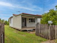  9 Ernest Street NORTH MACKAY QLD 4740 Nestled in the heart of North Mackay, 9 Ernest Street is a charming two-bedroom home that boasts character. Beautiful wooden floorboards add warmth throughout the main home, while the first level has been tiled in the bathroom, laundry, and toilet areas for low maintenance and convenience. Situated on a fully fenced 456m² allotment, this home offers privacy and a peaceful setting. The modern kitchen is designed for functionality, featuring ample storage and gas cooking, seamlessly flowing into the air-conditioned living and dining areas for year-round comfort. The main bedroom is larger than standard and includes a ceiling fan, while the second bedroom provides a cozy and inviting retreat. At the rear, a two-car carport ensures your vehicles are protected from the elements. Don't be fooled by the smaller allotment as the rear yard offers plenty of room for outdoor activities, making it an excellent space for families, pets, or those who love to entertain. Located just moments from cafes, schools, parks, IGA, a fuel station, a chemist, and more, this home offers exceptional convenience in a sought-after location. 