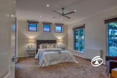  5 Rutland Rd Berwick VIC 3806 $1,650,000 - $1,750,000 Individually designed with exceptional attention to detail, this stunning contemporary residence is a masterpiece of style, comfort, and functionality. Set in one of Berwick Village’s most coveted locations, it offers the perfect balance of modern luxury and everyday convenience, just a short stroll from vibrant cafés, restaurants, and boutique shops. Principally set on one expansive level, this home boasts a thoughtfully designed floorplan, complemented by premium finishes throughout. Richly coloured Ironbark timber floors flow seamlessly underfoot, while a striking slumped glass feature window adds a dramatic touch to the open-plan living area. Floor-to-ceiling glass doors extend the space outdoors, seamlessly connecting the interior to an impressive covered alfresco deck. Here, you can entertain in style or unwind in tranquility while soaking in the breathtaking elevated views of Berwick’s picturesque landscape. At the heart of the home, the sleek and sophisticated kitchen is a chef’s dream. It features glass-topped benches, stunning Biltmore Cherry cabinetry, stainless steel appliances, and an abundance of storage—combining practicality with high-end appeal. The expansive living and dining areas are thoughtfully divided by custom-built cabinetry, creating the perfect space for relaxation and entertainment. The main level accommodates three spacious bedrooms, each with extensive built-in storage. The luxurious master suite boasts a walk-in robe and a private ensuite designed for indulgence. A generous home office provides the perfect work-from-home space, catering to modern lifestyles. On the lower level, a private guest suite with its own ensuite offers an ideal retreat for visitors or extended family. Adding to the home’s exceptional features is a fully fitted theatre room, complete a stylish wet bar—creating the ultimate in-home movie experience. Outside, beautifully landscaped gardens frame a second paved and covered BBQ area, extending onto private rear lawns. An oversized double garage with rear trailer access is complemented by extensive under-house storage, including a 25,000-litre rainwater tank. Comfort is assured year-round with hydronic panel heating, air conditioning, and energy-efficient 'smart glass' that enhances climate control. This exceptional home is an unparalleled opportunity to secure a modern sanctuary in an elite location—offering effortless access to the heart of Berwick Village and its renowned lifestyle amenities. 