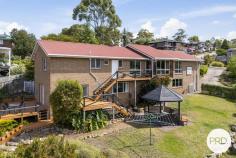  8 Radiata Drive Lindisfarne TAS 7015 $948,000 If you have been searching for a large family home with enough floor space so everyone is not walking over each other, then this 271sqm residence set on a 1271sqm block is probably just what you and your family need. With 6 bedrooms, all with built in robes, 2 bathrooms, separate powder room, separate laundry, 3 separate living rooms, 2 balconies, 1 deck, a gazebo, workshop and double garage, there are plenty of places for the children to play hide and seek. Both levels have reverse cycle air conditioners and there are also other heaters inside keeping the home warm all year round. The kitchen has just been modernised with new doors and drawers. It forms the centre of this home's meals and activities, and this part of the upstairs takes in relaxing north easterly views of hillsides and neighbouring suburbs. As for the street itself, it's a quiet cul-de-sac with other large family homes nearby. This location is seen as ideal, close to: private and public schools; Eastlands Shopping centre; public transport; medical facilities; sporting venues; a major hardware store; parks; TasTafe Clarence Campus and has easy access to the Tasman Highway. The garden area is large and has pear, banana passionfruit, grapes, lime and lemons but if you wish to increase the number of fruit trees, shrubs and vegetables then there is more than enough room to do so. The yard is secure and ideal for pets and children to play. Outside entertaining is made simple with 4 separate areas where you can sit outside in our warmer summer months and take in the fresh air whilst eating and/or sipping on your favourite beverages. Off street parking is also well catered for with a tandem garage and room for other vehicles. Loads of storage is located under the house with a separate storage room and a workshop/storage area adjacent to the garage. And for your added safety and peace of mind, you will find a camera surveillance and alarm system. 