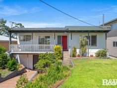 10 Penang St Point Clare NSW 2250 $1,240,000 - $1,280,000 Offered to the market for the first time in 60 years, this beautiful mid-century style home is a rare gem. Lovingly maintained by the same family, its retro appeal and incredible views makes it a ready-to-move-in opportunity for its new owners. Expansive windows throughout the home flood the interior with natural light, while showcasing breathtaking water views that stretch from Lion Island and Point Frederick to the Gosford waterfront and city skyline — creating a captivating outlook both day and night. Set on a generous 1,012sqm block in one of Point Clare’s most sought-after streets, with a national park as its backyard, this home is an exceptional find. Perfect for commuters who want to be a short walk from a train station or need a quick exit to the freeway. Located close to excellent schools, hospitals and important amenities, do not miss your chance to secure this remarkable piece of real estate. Features to Note: • Thoughtfully positioned front veranda and two rear entertaining areas maximize the stunning aspect and ensure privacy. • The terraced backyard provides a functional and safe space for children. • Secure fencing makes the backyard ideal for furry friends. • Three upstairs bedrooms, with floor-to-ceiling wardrobes; two of the bedrooms have plantation shutters and water views. • The main bathroom includes a shower, toilet, feature timber vanity, and plantation shutters. • Downstairs there is a 4th bedroom, a second bathroom with a shower, toilet, and vanity, plus a large living area—perfect for a teenage retreat, parent’s getaway, or extended family accommodation. This area can be divided from the upper floor to create a separate living space with a kitchenette and its own entry. • Expansive formal lounge with air conditioning and large feature windows with some of the best views on the Central Coast. • Formal and informal dining options. • Well-equipped kitchen featuring a Miele dishwasher, electric cooktop, Bosch oven, rangehood, plantation shutters, and ample storage space. • Single garage with an automatic roller door, plus extra space for a workshop and under-house storage. • Original timber flooring throughout the upper level, with new carpet on the lower level. • This home has a level front garden, 9kw solar system and has been freshly painted internally and externally. Convenient Distances: • Point Clare Train Station – approx. 700m • Brisbane Waters Waterfront – approx. 1.1km • Point Clare Primary School – approx. 350m • Point Clare Medical Centre & Chemist – approx. 640m • Point Clare Aldi – approx. 700m • Point Clare Shopping Precinct – approx. 740m • West Gosford Shopping Precinct – approx. 2.4km • National Park Walking Trails – approx. 150m • M1 Pacific Motorway – approx. 7km 