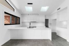  101 Lute Street Gundaroo NSW 2620 $1,550,000 - $1,650,000 Discover the perfect blend of modern elegance and timeless charm at this exquisite brand new 4 bedroom plus study residence located in Gundaroo's heights with expansive views over the village and surrounding region. This architectural masterpiece is designed to impress with its thoughtful layout and stylish finishes, making it an ideal family home or a sophisticated retreat for those seeking to work from home. The position is supreme sited at the top of Kyeema Estate on a hard to find 2.46acre (9963sqm) block. This allows plenty of extra space for shedding, boats and caravans or build the Taj Mahal of chook pens and have the chickens free-range across the block. The block is a blank canvass with excellent scope to create the edible gardens and orchards you've always dreamed of. Key Highlights: - Brand New Build: Completed in 2024. Custom built and never lived in. - Spacious Living: With four generously sized bedrooms, this home offers ample space for the family to have their own space and come together in the heart of the home in the open plan kitchen and meals areas. The master bedroom is particularly big and features a decadent en-suite bathroom and barn slider to the walk-in robe while a separate study provides extra flexibility as a 5th/guest bedroom. - Architectural Design: This home boasts stunning architectural elements, including an exterior comprised of red brick features, light grey render and monument coloured vertical cladding. With its high set ceilings, skylights and elegant double glazed black feature windows the interiors are flooded with natural light, seamlessly connecting indoor and outdoor spaces. - Stylish Interiors: The interior design reflects a harmonious blend of industrial chic and functional living, with high-end finishes throughout. Clean lines are accentuated by black door/tap hardware, hybrid flooring, feature panelling, and an abundance of joinery and feature lighting, some of which are sensor operated for ease. - Elegant Bathrooms: Enjoy the luxury of two beautifully designed bathrooms, complete with modern fixtures and finishes that elevate your daily routine. Under-tile heating adds an extra indulgence for the winter months. - Must Haves: Double glazed windows throughout, zoned ducted air-conditioning system, induction cooktop, stone benchtops and butlers pantry to kitchen, 50 point data cabling to communications rack in garage, mud room for extra storage, surround sound cabling to media room, ceiling fans throughout. A generous 107000 Litre rain water tank capacity. - Outdoor Oasis: The North Easterly orientation provides for a sheltered alfresco entertaining space which captures the cool summer Easterly's while a second SW facing entertaining deck is the perfect spot to finish the days end watching the sun set over the village and hills beyond. - Double Garage: A deep 7.5m x 7m double garage is a welcome addition with cabling in place to fit 2 EV car chargers (2 x separate 32A three-phase sub-circuits have been installed on either side of the garage) and extra shelving to the rear. - Space for expansion: A 14m x 14m site cut is in place for a future shed or tennis court with 3-phase power and communications cabling provisioned to a switchboard. - Prime Location: Situated a short walk in to the charming village of Gundaroo, with its Primary School, eateries, shop and park, makes this an ideal choice for families and professionals alike. School busses depart to Canberra's major schools for the older kids. Don't miss this opportunity to own a one-of-a-kind property that combines architectural elegance with modern convenience. Avoid the stress of building, just the landscaping to get underway and plenty of space to go around. 