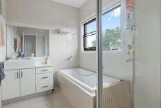  1/428 McClelland Drive Langwarrin VIC 3910 $699,000 - $749,000 Stacked with high-end finishes, clever storage, and a layout that just makes sense, this modern 3-bedroom townhouse delivers a home that's sleek, stylish, and straight-up effortless. A smart and effortless design that works for living easily has been crafted for maximum flow between indoors and out, ready for lively entertaining, kicking back, or just living your best life. Its open-plan living and dining zone is finished with large-format tiles and equally impressive natural light, filtering golden rays inside while peering out over its covered terrace and yard. The kitchen is a showstopper with warming tones and sleek stone benchtops surrounding stainless steel appliances, stepping outside to a private covered patio ready for morning coffees, sunset drinks, or lazing away. Three generous bedrooms include a downstairs master with a full ensuite and walk-through robe, with individual split-system comforts, a central bathroom and a separate toilet serving the upper level. Comfort is covered year-round with central heating and split-system air conditioning, while the remote double garage stores the wheels. Its location is near-unbeatable, just minutes from Karingal Hub, Mornington Peninsula Freeway, Karingal Heights Primary, McClelland College, and public transport, putting everything you need right at your fingertips. Whether you're a first-home buyer, a savvy investor, or looking to downsize without compromise, this one ticks every single box.  