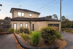  1/428 McClelland Drive Langwarrin VIC 3910 $699,000 - $749,000 Stacked with high-end finishes, clever storage, and a layout that just makes sense, this modern 3-bedroom townhouse delivers a home that's sleek, stylish, and straight-up effortless. A smart and effortless design that works for living easily has been crafted for maximum flow between indoors and out, ready for lively entertaining, kicking back, or just living your best life. Its open-plan living and dining zone is finished with large-format tiles and equally impressive natural light, filtering golden rays inside while peering out over its covered terrace and yard. The kitchen is a showstopper with warming tones and sleek stone benchtops surrounding stainless steel appliances, stepping outside to a private covered patio ready for morning coffees, sunset drinks, or lazing away. Three generous bedrooms include a downstairs master with a full ensuite and walk-through robe, with individual split-system comforts, a central bathroom and a separate toilet serving the upper level. Comfort is covered year-round with central heating and split-system air conditioning, while the remote double garage stores the wheels. Its location is near-unbeatable, just minutes from Karingal Hub, Mornington Peninsula Freeway, Karingal Heights Primary, McClelland College, and public transport, putting everything you need right at your fingertips. Whether you're a first-home buyer, a savvy investor, or looking to downsize without compromise, this one ticks every single box.  