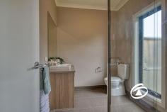  6 Camellia Dr Bunyip VIC 3815 $680,000 - $748,000 Large Scale Family Living Beautifully presented and custom-built, this spacious family home on a secure 721m² allotment offers a true move-in-ready lifestyle with nothing to spend. Designed for effortless comfort, it features two distinct living areas—a formal lounge and an open-plan living and dining space—complemented by a stylish kitchen equipped with 900mm stainless steel appliances, a dishwasher, ample bench and cupboard space, and a walk-in pantry. The home boasts four generously sized bedrooms, including an expansive master suite with a walk-in robe and a full ensuite. The remaining bedrooms are all oversized, each with a walk-in wardrobe, and are serviced by a modern family bathroom and a separate powder room. A versatile study adds flexibility, easily converting into a third living area or a functional home office. Step outside to a fantastic alfresco area, perfect for entertaining, overlooking a spacious backyard with lush, established gardens and a well-maintained lawn. Additionally, side access for extra vehicles, boats, or trailers can be conveniently achieved with the simple addition of a side gate. Ideally positioned within walking distance of Bunyip’s Main Street shops, cafés, schools, kindergarten, parks, sporting facilities, and the V-Line train station, this home seamlessly blends rural charm with modern convenience. 