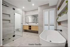  9 Serene Wy Yanchep WA 6035 $839,000 This immaculately presented home is perfectly positioned in a serene coastal location & boasts a super stylish finish with a sophisticated family-friendly layout. If you’re looking for a unique home where all the work has been done, then look no further as this five-star dream residence is loaded with luxury upgrades and is ready to move into today! Boasting approximately 290sqm of total living, this is your chance to settle into one of the northern corridors’ most desirable and rapidly evolving suburbs! For more details CALL NOW to submit your interest and make an offer today! Approximately 1km to the tranquil blue waters of the Indian Ocean, nestled amongst quality homes and friendly neighbours, this picture-perfect property is conveniently located within a short drive to the iconic Lagoon, Sun City golf course, schools, shops & supermarkets, cafes & restaurants, the bowls club and the ever-popular Yanchep National Park where the kids can spot the kangaroos and enjoy peaceful strolls through the nature trails. With the recent opening of the Yanchep train station and the Romeo Road freeway access point just down the road, inner city commutes have never been so easy! Simply exquisite in design, this custom built ‘Fratelli’ home is instantly appealing to the eye and oozes grandeur from the outset with meticulous attention to detail! The impressive, rendered façade with a coastal weatherboard finish, grand portico, heightened double garage, and paved crossover for additional parking, deliver a look of pure class whilst the fully manicured gardens & ambient lighting offer you the perfect welcome home. When the owners built this home, they wanted to create a modern masterpiece with a finish they could be truly proud of, so you can expect the best! Notable upgrades include feature lighting, plantation shutters, solid stone benchtops, upgraded sinks & tapware, ducted reverse cycle air-con, water filtration, synthetic lawns…to name but a few! Opening up to lofty high ceilings and fresh neutral décor throughout, you are greeted with a calming ambience as soon as you set foot into this impeccable residence. Nicely secluded at the rear of the home, the master suite is spacious in size and features a large fitted walk-in robe, vinyl plank flooring, crisp white skirting boards, ceiling fan and LED lighting throughout. The upgraded ensuite is like something you would see in vogue magazine, boasting floor to ceiling tiles, dual vanities + additional storage, shower, a luxurious free-standing bath, separate w/c and well-designed niches provide a place to store all your beauty essentials in style. The three additional bedrooms are all queens, fitted with double mirrored sliding robes, sumptuous carpets, and finished with fresh neutral décor, all encircling the family bathroom which, like the master’s, has been finished to the highest standards with a large glass shower, stone benchtops, floating vanity and upgraded fixtures & fittings. Central to the home, the deluxe kitchen is simply stunning in design and is every entertainer’s dream! If you fancy yourself as a bit of a budding “masterchef”, you’ll really appreciate the functionality & finish of this contemporary classic! Features include 900mm stainless steel appliances + rangehood, a large island breakfast bar with ‘Essa’ stone benchtops gives you masses of storage and space for meal prep! The magic doesn’t stop there though, beyond the exposed brick feature wall awaits a well-appointed scullery which includes an undermounted sink, dual ovens, dishwasher, double fridge recess (plumbed), and a huge built-in pantry giving you even more storage for you to take advantage of! For quality family time and meals, the open plan living & dining is the place to be! Drenched in natural light, this warm & inviting living area boasts a sophisticated yet relaxing vibe! The high ceilings, beautiful flooring, soft window treatments and tranquil garden views ensure you will never feel like the walls are creeping in on you! If you’re a bit of a “movie buff” simply head to the theatre room which is great for movie nights or games with the kids! With built-in cabinetry and stylish shutters, this cozy space can be closed off from the main living areas for added privacy and comfort! When it comes to entertaining, the outdoor area and private garden offers the ultimate setting for parties & social gatherings! The entire alfresco area extends out through the use of stacker doors and will impress all of those who are lucky enough to view! This tranquil outdoor paradise is immaculate in its presentation and the owners have created a “maintenance free” haven which pretty much looks after itself, meaning you and your guests can just sit back with a cold glass of wine and enjoy your new surroundings in peace. Framed with elevated garden beds & native plants overlooking pristine synthetic lawns, you have a safe place for the kids and family pets to play. To truly unwind, indulge in the luxurious swim spa – perfect for relaxing in at the end of the day and reflecting on what a pleasure it is to call 9 Serene Way your home. This remarkable Yanchep property offers a blend of luxury, convenience, and coastal charm, so don’t miss the opportunity to make it yours! Extras Include: Double remote garage (heightened), separate laundry + fitted linen, solar panels, ducted reverse cycle air-con, 3x ceiling fans, LED lights, security camera system, 1x TV bracket, additional TV + data points, water filtration system, built in cabinetry, skirting boards, tinted windows, swim spa + retractable awning shade, and so much more. 