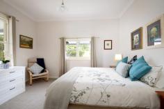  55 Hat Hill Road Blackheath NSW 2785 $1,050,000 - $1,150,000 Nestled in the heart of the Blue Mountains, this beautifully maintained classic weatherboard home offers a serene and comfortable mountain lifestyle. With a perfect blend of traditional charm and modern amenities all within a short walk to Blackheath village. Features include: • Open Plan Living: A spacious kitchen with modern appliances, dining, and living area with a gas fireplace and central heating, ensuring year-round comfort. • Master Bedroom: Complete with an open fireplace and a luxurious ensuite featuring a deep bath - a perfect place to relax and unwind. • Climate Control: Reverse cycle air conditioning for added comfort throughout the seasons. • Timber Flooring & High Ceilings: 10-foot ceilings and beautiful timber flooring add to the home's warmth and charm. • French Doors & Double Hung Windows: Offering an abundance of natural light and a seamless connection to the outdoors. • Large Main Bathroom: Stylishly appointed for ease and comfort. • Entertainment Deck: Enter through the French doors onto a covered deck, perfect for entertaining or relaxing while enjoying the peaceful surroundings. • North-East Aspect: Flooded with natural light throughout the day and energy efficient with solar panels and water tank. • Professionally Landscaped Gardens: Featuring mountain natives, cold climate plants and meandering granite pathways. A firepit area provides a stunning outdoor space. • Corner Block: Enjoy privacy and space with the benefits of a corner position and fully fenced block. • Double Garage: With remote access for convenience and EV charger station • Walk to Blackheath Village: Just a short stroll to local shops, cafes, and everything the village has to offer. This immaculate property combines timeless appeal with modern functionality, offering a true mountain escape. Don't miss the opportunity to make Currawong your new abode. 