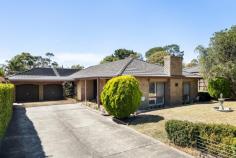  13 Brompton Close Frankston South VIC 3199 $910,000 - $1,000,000 ~Park-side living with exciting future potential ~ Mere steps from the open space and playground of Raymond Reserve, this tidy four-bedroom home nestles within a quiet cul-de-sac, effortlessly blending family-focused comfort and coveted Frankston convenience. Beyond its secure frontage, an inviting in-ground pool shimmers while dual living zones and generous off-street parking cater to the needs of growing families. Designed for ultimate family functionality, this home features two distinct living zones, a formal dining area, and a central kitchen equipped with modern benchtops, a 900mm gas cooktop, and a Westinghouse wall oven. The welcoming entertaining space is complemented by the warmth of a solid wood heater, while the ease of split-system heating and cooling ensures year-round comfort. Accessed from a central hallway lay three light-filled bedrooms and the main bathroom with separate toilet, including the master with functional ensuite and full-height robes, while the fourth bedroom off the living zone welcomes a perfect working-from-home space. Established gardens spill from front to back, embracing an in-ground pool and private covered patio, while additional features include plantation shutters, a double garage with workshop space and rear roller door access, a double carport, exterior security blinds (front only), and a fenced perimeter. Set within easy reach of Derinya Primary School (DPSZ), Woodleigh School - Minimbah Campus, Mount Erin College, Frankston's Bayside Shopping Centre and easy freeway access. With public transport, parklands, and playgrounds a plenty, this private brick home provides a comfortable base for families with a future creative vision. 