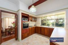  4 Avon Cres Viveash WA 6056 $1,400,000Occupying an enviable position on the banks of Blackadder Creek, this multi-generational property is an ideal balance of convenience, comfort and considered style. The principal residence (4 bedrooms, 2 bathrooms, 2 carparks) invites you into a world of sophistication and functionality: formal and informal living, a separate games room and a conservatory. Designed with a focus on light and space, the auxiliary residence/granny flat (2 bedrooms, 2 bathrooms, 2 carparks) is equally impressive. Raked ceilings amplify the openness, while a bright, neutral palette enhances the airy atmosphere. Multiple living and entertaining zones make it perfect for hosting guests or offering independent living for extended family. Main home – 4 bed 2 bath 2 car Granny flat – 2 bed 2 bath 2 car 1995-built multi-gen home Formal and informal living Study games and library Conservatory & garden shed Sep driveways high carport Overlooks Blackadder Creek 1113 sqm sep driveways Walk to the Swan River An unparalleled opportunity for multi-generational living. From the moment you approach the iconic bullnose verandah and step inside, the home’s exquisite details – such as leadlight windows and decorative cornices – capture your imagination, creating a space designed to inspire and delight. A sense of grandeur permeates the principal residence, where high ceilings, ceiling roses and picture rails enhance the timeless aesthetic. The calming palette of colours and materials infuses the home with an air of tranquillity, making every room a welcoming retreat. A landscaped front garden leads to a formal with a versatile home office to one side, ideal for quiet study or remote work. Adjacent is the formal lounge, a generously proportioned space perfect for relaxing or gathering with family or entertaining. This room flows seamlessly into an elegant dining room, where polished jarrah floors tie together the formal spaces and guide you toward the heart of the home. The jarrah-cabinet kitchen is as practical as beautiful, featuring a U-shaped benchtop, an electric oven, and a gas hob. Large windows frame views of the backyard and the riverbank beyond, bringing a natural connection to your daily routines. From here, the space transitions effortlessly into an open-plan family room and meals area, where a sliding glass door leads to the south-facing verandah, a charming conservatory, and the lush backyard and French doors open to a spacious dedicated games/activity room. These areas are perfect for entertaining or enjoying peaceful moments surrounded by nature. A separate library offers a delightful retreat for quiet contemplation. Throughout the home, intricate leadlight windows add character and charm, their colourful designs blending harmoniously with the overall decor. The principal bedroom boasts a circular leadlight medallion plush carpet underfoot, a walk-in robe and an ensuite with a separate powder room. The junior bedrooms sit in a separate wing; each has built-in robes, and two have split system air-conditioning. The junior rooms share the family bathroom and a second powder room. The auxiliary accommodation is accessed via a separate driveway leading to a high-clearance carport. The front door opens to a spacious, light-filled open plan with split air conditioning, exposed beams, and a raked ceiling comprising a living room, meals area, and kitchen. A white palette dominates her, its fresh, crisp quality emphasised by the contrast of black bench tops. The kitchen has an electric oven and dishwasher and space for a washing machine. At the rear of the plan is a spacious indoor/outdoor room with a sliding door to the back verandah and yard. A fitted BBQ and sink and a walk-in storeroom sit along one wall of this multi-use space. Two bedrooms with split air-conditioning and ensuites offer comfortable accommodation for guests or family. This residence is ideally suited for multi-generational living, offering ample space and versatility while maintaining a warm and inviting atmosphere. Whether hosting formal gatherings, unwinding in the conservatory, or relaxing in the backyard gazing across the creek’s banks, this property provides a unique lifestyle that fosters connection and independence. Uncover the charm of Viveash, a tucked-away riverside enclave with unparalleled access to the Swan River parks, walking trails, and scenic reserves. This hidden location combines riverfront living with the convenience of nearby Midland, La Salle College, and Saint Brigid’s Primary School, offering the ideal setting for the entire family to thrive. 