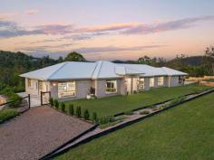  152 Banks Creek Road Fernvale QLD 4306 $1,399,000 A stunning 2021 built, 361m2 modern Metricon home on a magnificent 7458m2 block, boasting a number of features for the ultimate entertainer's home. This exciting and fully landscaped 4-bedroom, 2-bathroom, multi living area home features 2.6m high ceiling throughout an open living-floor plan with a spaciously designed U-shaped kitchen and a large walk-in butler's pantry that leads out onto an extended 11.5 x 5.7m deck with a serene view of the somerset region. Space and storage pose no issues with this property, with the inclusion of 2 generous-sized garden sheds and a powered 9m x 6.2m workshop attached to an equally sized 2-bay undercover carport with additional parking for guests. Not forgetting the inclusion of an 8m heated pool, this home will be the go-to hub for entertainment. Whether you're looking for space, comfort or lifestyle, this home has 4 generous sized rooms with built-in robes, excluding the large master bedroom which includes a spacious walk-in robe and ensuite with a freestanding bathtub and double vanity, as well as a private media room and an open lounge area or rumpus room, and a full-sized laundry inclusive of a walk-in linen cupboard for storage. Nestled within the quiet community of Fernvale, just minutes from local schools, shops and parks, you are sure to have everything you need to feel close to everything, but perfect for anyone seeking a serene lifestyle without sacrificing convenience. Somerset Council Rates: $978 per half year (subject to change) Features • Four bedrooms, including a master suite with an ensuite and WIR • Modern kitchen with 20mm stone benchtops and a spacious L-shape butler's pantry • Open-plan living and dining area, media room, lounge or rumpus. • Ducted air conditioning and smart home setup with ability to control AC & Lighting from your phone • Fully landscaped outdoor area with timber deck with expansive views • 8m heated swimming pool • 9m x 6.2m shed with additional undercover carport and two garden sheds • Accommodates up to 6+ vehicles • Within catchments for Fernvale State School & Lowood State High School • NBN Satellite Internet (Starlink also available) • 6.5KW solar system • 10,000L water tank with pump plumbed to shed Locations: 2 minutes to the heart of Fernvale which includes the iconic Fernvale Bakery. 1 Minute to PCYC Fernvale which includes a recreational gymnastics program, 24/7 gym and fitness centre 2 minutes to the nearest Childcare Centre 4 minutes to Fernvale State School 11 minutes to Lowood State High School 28 minutes to RAAF Base Amberley 25 minutes to Ipswich CBD 56 minutes to Brisbane CBD 