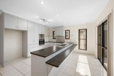  30 Coolibah Street Kin Kora QLD 4680 $849,000 It's a pleasure to introduce this stunning family home, boasting 4 generous sized bedrooms, 2 bathrooms, 2 separate living areas, double garage plus extra storage space underneath and an inviting inground pool. Set on an elevated 754m2 block at the end of a peaceful cul-de-sac, surrounded by quality homes, this property offers an ideal lifestyle for growing families. Step inside to discover a well-designed layout with modern finishes and thoughtful features throughout. Upon entering, you're greeted by a charming entry area that sets the tone for the rest of the home. It's a versatile space you can personalise to your taste, add a comfortable chair and some greenery, to create an inviting first impression. A spacious combined kitchen, dining, and living area takes centre stage of this residence, complete with split system air conditioning to keep you cool and comfortable all year round. This open-plan design flows seamlessly through double sliding doors to the tiled outdoor entertainment area, where you can enjoy beautiful views while taking in the sweeping views from your pool. The generous sized kitchen has everything you need to whip up delicious nightly meals or special dishes for entertaining family and friends.There is ample cupboard space, wide drawers, and a long, stylish laminate benchtop with a dual-purpose breakfast bar. You'll also enjoy the convenience of a separate pantry, electric oven and stovetop, and a dishwasher to make clean-up a breeze. Adjacent to the kitchen, the spacious tiled dining and living area is designed for both comfort and practicality. Complete with a split system air conditioner and ceiling fan, this versatile space offers plenty of room to create a stylish living area and set up a modern dining suite. There's even enough space to incorporate a desk, perfect for the kids to tackle homework or enjoy their craft projects. A separate media room offers the perfect space for a true cinema experience. Carpeted for comfort and large enough to accommodate a cosy theatre lounge. This room is fitted with doors that can be closed off to create a quiet area, ideal for movie nights or gaming sessions. All 4 bedrooms are generously sized and feature newly laid soft carpet underfoot, built-in wardrobes to help keep your space organised, ceiling fans for comfort, and large windows that allow plenty of natural light to fill each room, creating a bright and welcoming atmosphere. 2 of the bedrooms have split air conditioning including the master bedroom. The master bedroom, situated away from the other 3 bedrooms, is a true sanctuary, which has private access to the back deck, perfect for enjoying a quiet morning coffee or evening unwind. It includes a walk-in robe and a modern ensuite complete with its own amenity. A lovely treat for the adults to enjoy some well-deserved quiet time. For added convenience there is a walk-in storage cupboard located in the hallway. The useful space has plenty of shelving to store all your personal items and kids toys. You'll enjoy some well-deserved pamper time in the main bathroom, which features a separate shower and bath, perfect for soaking the day away. Natural light beams through the window, creating a bright and welcoming atmosphere that makes the space feel fresh and relaxing. Adjoining the living room is a fantastic outdoor deck, ideal for entertaining family and friends while the kids splash around in the pool. It's the perfect spot to relax, soak up the breezes, and take in the breathtaking views all while sipping on your favourite cocktail. The standout of this home is the workshop and storage area located underneath the home. There is ample space to store a small tinnie, a camper trailer or motorbike. There is additional space to lay down some carpet and use this area as a rumpus room for the kids. For convenience this area has its own amenity. DON'T MISS THIS FANTASTIC OPPORTUNITY TO OWN YOUR DREAM HOME IN SOUGHT AFTER SUBURB OF KIN KORA! AT A GLANCE:- • Security screened throughout • 2 separate living areas • Large living, dining and kitchen • Newly laid carpet in all bedrooms & media room • Beautiful entertainment deck with view • In ground pool comes (pool compliance certificate available) • Extra storage space underneath • Water tank • Timer pop up lawn irrigation system for all lawn areas & gardens • Quiet cul-de-sac • Near schools and shops 