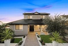  14 Lowry Street Mount Lewis NSW 2190 Perfectly poised on a spacious 651.3m block, showcasing outstanding district views capturing gorgeous sunsets, is this oversized family home, which offers seven bedrooms, four bathrooms, five toilets, multiple living / entertaining zones as well as plenty of car accommodation. Located in one of Mount Lewis's best streets, positioned across from Mount Lewis Park, walking distance to Mount Lewis shops and just moments from Bankstown's CBD, Al Noori Muslim School, St Charbel Church and College, Punchbowl station and shops as well as Greenacre amenities. Location does not get any better than this. This home is perfect for large families or multiple families living under one roof. Offering plenty of potential for the future, this home also has a wide 15.21m frontage. This home offers: Seven bedrooms, all with built-in wardrobes, two with ensuites Large kitchen with gas cooking and breakfast bar Large living room with fireplace, which extends to the sunroom Covered Alfresco area is perfect for entertaining Flexible space offers a kitchenette and toilet. Perfect for a home business or those who work from home Main bathrooms across both levels Separate laundry Under house storage Driveway access to the rear providing off-street parking for four cars or more. 