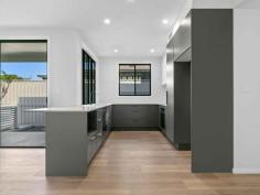  3/21 Warrah St Ettalong Beach NSW 2257 $1,250,000 - $1,300,000 Welcome to 3/21 Warrah Street, Ettalong Beach. This brand new townhouse will surely impress with quality fixtures and finishes throughout and its own private northeast facing courtyard all within 500 meter level walk to Ocean Beach The townhouse features include: - Three large bedrooms all with robes and ceiling fans the master conveniently located downstairs with a walk-in robe and designer ensuite bathroom with floor to ceiling tiling, semi frameless shower, toilet, and custom vanity - The main bathroom features floor to ceiling tiling, shower, free standing bathtub, toilet and custom vanity. A powder room downstairs with a toilet and washbasin. - Generous open plan lounge and dining flows to the covered alfresco space. A second living area is positioned upstairs with a double linen press. - The kitchen is large featuring Fisher Paykel dishwasher, 900mm induction cooktop, under bench oven, slide out drawers to pantry ideal for maximising space and 20mm tops - A generous covered alfresco space flowing off the dining area is perfect for entertaining family and friends and a northeast facing courtyard with a small grass area as well. - The ceilings are 2.7 metres that accentuate size and space with 7.2kw Fujitsu ducted air conditioning throughout the home and alarm system for security - Engineered Oak timber flooring in the downstairs dining and living are and from the stairwell and upstairs bedrooms all carpeted - The home offers an oversized double garage with internal access and automatic door with a fitted laundry unit - Natural gas and NBN connected This is a truly unique property in a blue-chip location that is a short walk to Umina Beach, Public Transport and all local eateries, cafes and restaurants. 