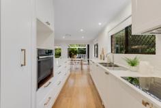 3 Norfolk Way Buderim QLD 4556 Located in one of Buderim's most sought-after and prestigious locations, this beautifully refurbished home offers a seamless blend of elegance, comfort, and modern convenience. Sitting on a generous 800 sqm block, the property provides an exceptional lifestyle with easy access to the heart of the village and its fine dining, boutique shops, and local amenities. The home has been meticulously redesigned to capture the essence of Hamptons-style living, creating a welcoming atmosphere from the moment you step inside. With a north-facing aspect, the property basks in an abundance of natural light, offering stunning views of the surrounding parkland reserve and tree lined creek, which can be enjoyed from the comfort of your own home. Key Features: • Open-Plan Living: generous living areas flow effortlessly into the alfresco dining space, creating a perfect environment for family gatherings and entertaining. • Gourmet Kitchen: the heart of the home, designed for both style and functionality, includes high-end finishes, ample storage, and premium appliances, making it ideal for culinary enthusiasts. • Light-Filled Reading Nook: a cosy, serene space that invites you to unwind and enjoy a book while soaking in the surrounding natural beauty. • Alfresco Entertaining: spacious & inviting, the deck provides the perfect backdrop for entertaining guests or enjoying quiet moments, surrounded by lush greenery and the sounds of local birdlife. • Three spacious and well-appointed bedrooms: each bedroom offers a peaceful retreat with ample space and built-in wardrobes, ensuring comfort and privacy for all family members. • Two Deluxe Bathrooms: both bathrooms are beautifully appointed with high-end fixtures, offering a spa-like experience at home. • Energy-Saving Features: the property is equipped with solar electricity and hot water with zoned ducted air conditioning, providing both energy efficiency and year-round comfort. • Private and Peaceful Setting: with rear access and no rear neighbours, enjoy ultimate privacy and tranquillity in your own slice of paradise. • Prime Location: walk to the village for cafes, shopping and enjoy a central position that is still peaceful and quiet. This rare opportunity presents a quality offering in one of the most coveted positions in Buderim, making it an ideal choice for those looking for both convenience and luxury in their next home. Estate finalisation offers the perfect moment for you to secure this outstanding property. 