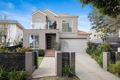  1B Orchard Grove Frankston South VIC 3199 $1,270,000 - $1,370,000 Featuring an elegant design rich in detail and impressive craftsmanship, this Olivers Hill home beautifully acknowledges its significant beachside setting with south-facing bay aspects and a seamless indoor-outdoor flow. Set within an exclusive neighbourhood where scenic walking paths lead directly to Frankston Beach, Sweetwater Creek Reserve, and Bayside Shopping Centre, it offers convenient access to public transport and local cafes. Creating a warm and inviting atmosphere, the generous open living and dining spaces extend beyond a stone-finished kitchen, equipped with a butler's pantry, 900mm cooking appliances, island bench, and a Blanco dishwasher, making it easy to enjoy good food and great company. The soft glow of a gas log fireplace envelops chilly evenings in warmth, while a spacious covered deck, complete with a built-in barbecue offers a delightful setting for year-round alfresco entertaining. Three bedrooms and three bathrooms highlight a dreamy master suite, where an impressive dressing room and stylish dual vanity ensuite, complement a dedicated study nook and private balcony. Finalising with a dedicated study with garden views, a powder room, and double garage with internal access, the home's added extras include gas ducted heating, evaporative cooling, and a ducted vacuum system. Holding a lucrative Frankston High School zone address, only moments from Mount Eliza Village, Toorak College, and Frankston Hospital. 
