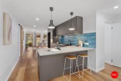  2A Allott Court Spring Gully VIC 3550 $575,000 - $625,000 Designer style meets unwavering low maintenance at this beautifully renovated 3-bedroom home on an easy-care allotment in a quiet and sought-after pocket of ever-popular Spring Gully. Perfect for retirees, young professionals and even first-home buyers, the sun-swept offering has been finished to a high standard throughout and includes distinct living and dining areas separated by a centrally positioned entertainer's kitchen. Flaunting a sophisticated colour palette, this chef's dream setting is highlighted by a chic tiled splashback, ebony cooking appliances and a fully integrated dishwasher. The serene master bedroom with walk-thru robes enjoys direct access to the semi-ensuite bathroom which has been updated to impress with LED bathroom mirror with a Bluetooth speaker. Two additional bedrooms are also offered along with a smartly appointed laundry and garage with handy shopper's entry. Striking barn doors, glorious wide-board flooring & plush carpeting are among the luxurious extras, while other notable features include refrigerated heating and cooling, a 6.29kw solar array & undercover alfresco patio for endless outdoor enjoyment. Set amongst leafy yet easy-to-maintain gardens, 400m to Bus Stop and short walk to One Tree Hill park and Spring Gully Trails for hiking and mountain biking, the home is close to a host of local amenities including the primary school, Latrobe University, One Tree Hill Hotel and the post office, while Bendigo's CBD is within reach for a stress-free workday commute. 