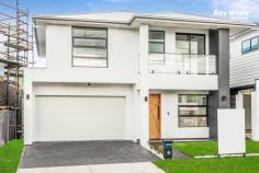  28 GREENOUGH Crescent Marsden Park NSW 2765 Brand New Architecturally Designed this spacious double-storey home is an entertainer's dream. sitting on a high side of the street designed with sleek contemporary aesthetics which is ultra-modern in concept and warmly inviting. Located close to St Luke, Northbourne public and upcoming Elara Village shopping centre. * brand new 5 bedroom, 3 bath,includding 2 masterbedroom house with builder warranty. * Spacious wide entry foyer via large doors. * Massive light filled open plan dining & living zone. * Additional Study knock /office spaceor puja space. * Sleek & stylish kitchen features large island bench with 60mm Caesarstone tops and waterfall edging, quality stainless steel appliances, gas cooking, dishwasher and built-in microwave oven. * 5 indulgent bedrooms with walk-in robes. * 2 Masterbedroom with ensuite bathroom. * 3 ultra modern bathroom with stone-top vanity, bath and shower. * Generous study / home office. * Walk-in pantry. * 2 Huge master suite comprises of large walk-in robe and palatial ensuite with freestanding bathtub and vanity . * Second luxurious master bedroom downstair. * Modern family bathroom with freestanding bathtub with toilet. * Automatic double lock up garage with internal access. * multi-zone ducted air-conditioning ensure this home sets a benchmark for comfort, style and conscience. * Down-lights throughout the home. * Huge, secure back yard. * Short Drive to Business Park - Costco, Ikea, Bunnings,Riverstone ,Schofield's train station & Greenway Shopping Centre. * Easy access to Richmond Rd and M7, Bunnings, Costco, Greenway Shopping Centre * Close to playing fields & upcoming shopping centre. 