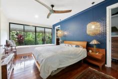  43 Bramley Drive Tallebudgera Valley QLD 4228 Immersed in supreme seclusion and tranquillity, this award-winning rainforest retreat will nourish your soul. Cocooned within 9.2 unspoilt acres and set upon an elevated and concealed plateau, it is a purely private slice of paradise. Hosting a Singaporean pavilion-style residence, the unique home reveals itself as you step through the centuries-old double Indian front doors. Architecturally designed to embrace a centrepiece pool, it's complemented by character-rich hand-built rock walls, hardwood floors and galleries of glass to ensure an ever-present connection to nature. Just as impressive is the seamless indoor-outdoor flow. The open plan kitchen, living, and dining area spills onto an expansive alfresco deck, serving as a protected all-weather living and entertaining zone. Bordered by established foliage and softly streaming water features, host guests in style, relax to the soothing sounds of nature or even indulge in your daily yoga routine. Beyond, the tiled pool promises rejuvenation or meander the grounds to where multiple charming spots cater to relaxing and reflecting amongst the lush greenery. In cooler months, unwind fireside in the lounge room, where blissful bushland views wrap around its exterior, or settle back on the day bed built into the master suite, overlooking the meditative beauty of the outdoors. A second bedroom with a stylish ensuite, built-in robe, and private deck provides a serene space for guests or family. A natural wonderland that requires minimal upkeep, this means more time to explore the walking trails that meander through the virgin landscape or enjoy the equestrian amenities. Additionally, with a spring creek, fruit trees, herb garden, veggie patch, and ample water storage, it also offers a taste of sustainability. An estate that feels far removed from the urban sprawl, you'll be surprised to find schools, shops and parks are close by. You can even feel the sand beneath your toes in under 20 minutes! Experience its pure peace, beauty and privacy for yourself – inspect today. House Features: Elevated, award-winning tropical rainforest hideaway tucked away in unsurpassed privacy and tranquillity Singaporean U-shaped pavilion-style architecture, with the single-level home encasing a centrepiece pool Galleries of glass throughout ensure an ever-present connection to nature Rich with character and warmth, boasting centuries old double Indian front doors, hand-built rock walls and hardwood floors Open plan kitchen, living and dining zone spills onto an expansive entertaining deck Lounge room captures lush bushland views and includes a cosy fireplace Spacious master suite featuring a modern ensuite and a built-in day bed overlooking the emerald greenery outdoors Second bedroom with a stylish ensuite, built-in robe and private deck Sprawling covered alfresco deck cocooned by established foliage and softly streaming water features – acts as an all-weather living and entertaining zone Tiled pool with rock feature wall Multiple outdoor areas to relax and reflect amongst the lush greenery Double carport Laundry with a handy extra powder room Air-conditioning and ceiling fans Property Features: Supremely secluded 9.2 acre estate completely hidden from the street Low-maintenance virgin rainforest landscape includes walking trails and a spring creek Natural wonderland, where you'll find king parrots, koalas and wallabies at play Established fruit trees, organic herb garden and veggie patch 3m x 3m shed Fully fenced horse paddock plus a tack room and stable 35,000L and 13,000L water tanks Location: Approx. 2 mins to Ingleside State School Approx. 4 mins to Harley Smith Reserve Approx. 10 mins to Tallebudgera State School and shops Approx. 10 mins to St. Andrew's Lutheran College Approx. 17 mins to The Pines, Elanora Approx. 19 mins to Burleigh Heads Approx. 21 mins to Currumbin Beach Approx. 23 mins to Gold Coast Airport 
