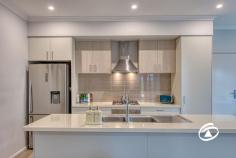  10 Corbin Walk Officer South VIC 3809 $600,000 - $660,000 Ideal for first home buyers or downsizers, this modern and bright double-storey three-bedroom townhouse is located within the sought-after Kaduna Park Estate. Overlooking a serene park, it offers a convenient and relaxed lifestyle. The home features high ceilings and an open-plan design, with two living areas (one upstairs and one downstairs) plus outdoor spaces for everyone to enjoy. The stylish kitchen includes a stone-topped island bench, gas cooktop, oven, and dishwasher, perfect for home chefs. Step outside to a low-maintenance, undercover decked area, ideal for entertaining guests. The downstairs master bedroom boasts a private ensuite and walk-in wardrobe, while upstairs, two additional bedrooms with built-in robes and new carpeting offer comfort and privacy. An upstairs retreat area can serve as a teen hangout, games room, or quiet study/home office, and the private balcony provides lovely views. The main family bathroom is upstairs with a separate WC, plus a bonus powder room off the entry for guests. Additional comforts include fans, ducted heating, split system air conditioners, tinted front windows, and a double garage with storage shelving and internal access. Conveniently located, you're just minutes from Cardinia Road train station, Arena Shopping Centre, Lakeside Shopping Centre, Caversham Waters Wetlands, and a variety of schools, childcare centres, and recreational facilities. Don't miss out on this fantastic opportunity! Book an inspection today and make this house your home. 