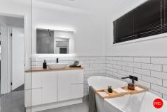  2A Allott Court Spring Gully VIC 3550 $575,000 - $625,000 Designer style meets unwavering low maintenance at this beautifully renovated 3-bedroom home on an easy-care allotment in a quiet and sought-after pocket of ever-popular Spring Gully. Perfect for retirees, young professionals and even first-home buyers, the sun-swept offering has been finished to a high standard throughout and includes distinct living and dining areas separated by a centrally positioned entertainer's kitchen. Flaunting a sophisticated colour palette, this chef's dream setting is highlighted by a chic tiled splashback, ebony cooking appliances and a fully integrated dishwasher. The serene master bedroom with walk-thru robes enjoys direct access to the semi-ensuite bathroom which has been updated to impress with LED bathroom mirror with a Bluetooth speaker. Two additional bedrooms are also offered along with a smartly appointed laundry and garage with handy shopper's entry. Striking barn doors, glorious wide-board flooring & plush carpeting are among the luxurious extras, while other notable features include refrigerated heating and cooling, a 6.29kw solar array & undercover alfresco patio for endless outdoor enjoyment. Set amongst leafy yet easy-to-maintain gardens, 400m to Bus Stop and short walk to One Tree Hill park and Spring Gully Trails for hiking and mountain biking, the home is close to a host of local amenities including the primary school, Latrobe University, One Tree Hill Hotel and the post office, while Bendigo's CBD is within reach for a stress-free workday commute. 