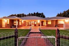  3040 Fourteenth St Irymple VIC 3498 $1,190,000 - $1,309,000 Damian Portaro, Principal & Chairman's Elite Sales Agent at Ray White Mildura, is proud to present 3040 Fourteenth Street, Irymple-a stunning lifestyle property set on approximately 8.67 acres in one of the region's most sought-after locations. This sprawling brick veneer family home, spanning over 35 squares, combines country charm with modern comforts, offering a versatile space for growing families, entertainers, or those seeking a semi-rural escape. Designed for effortless living, the home features four generously sized bedrooms, including a grand master suite with an ensuite, walk-in robe, and even a spa, creating the perfect retreat. Two additional bedrooms boast walk-in robes, while the fourth includes a built-in robe. A separate study and a large office provide work-from-home flexibility or could easily convert into extra living spaces. A choice of multiple living areas enhances the home's appeal, from the formal lounge to the vast open-plan kitchen, meals, and living space. The kitchen, designed with both style and practicality in mind, is a welcoming hub for family gatherings. For those who love entertaining, the incredible underground cellar is not only an exceptional storage space but also serves as a unique rumpus or additional lounge area. Comfort is assured year-round with in-floor heating, gas heating, and evaporative cooling, while an impressive 25kW solar system helps keep energy costs to a minimum. Step outside to a beautifully established yard featuring a sparkling pool, an outdoor entertaining area, and a firepit zone, perfect for relaxing under the stars. For those needing space for hobbies, trades, or equipment, the shedding on this property is nothing short of exceptional-offering a 26m x 12m shed, plus an additional 26m x 7.5m shed, ensuring ample room for machinery, tools, vehicles, or even a home-based business. Located in prime Irymple real estate, this is a rare opportunity to secure a large-scale lifestyle property with every amenity imaginable, while still being conveniently close to schools, shopping precincts, and sporting facilities. 