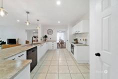  96 Watarrka Dr Parkinson QLD 4115 Welcome to a home that feels just right from the moment you arrive. This beautifully presented residence offers a perfect blend of comfort, space, and simplicity—ideal for families or anyone looking to settle into a peaceful lifestyle. The front garden is neatly landscaped, offering a welcoming path to the front door and a sense of calm with every step. Inside, natural light pours through large windows, highlighting the fresh, neutral palette and polished timber-style floors. The open-plan layout connects the spacious living area to the heart of the home—a sleek and functional kitchen fitted with modern appliances, stone-look benchtops, and ample cabinetry. Pendant lights above the breakfast bar add a warm, stylish touch, making it the perfect spot to gather. Adjacent to the kitchen, the dining nook sits surrounded by large windows and sheer curtains, offering a bright and airy space to enjoy your meals. The main living area flows seamlessly into a second lounge space, cozy and inviting, ideal for relaxing or catching up on your favourite show. The bedrooms are generously sized, with soft lighting, ceiling fans, and built-in wardrobes that offer both comfort and practicality. The master bedroom features a walk-in robe and a private ensuite, while the main bathroom includes a full bathtub, a glass shower, and clean, modern finishes. A separate laundry room adds extra convenience, with direct access to the backyard and plenty of space for everyday needs. Step outside and you'll find a massive, fully fenced backyard with lush green lawns—perfect for entertaining, playing, or simply unwinding at sunset under the soft glow of the sky. Every inch of this home has been thoughtfully styled and well-maintained, giving it a fresh and welcoming atmosphere. From the neat exterior to the light-filled interiors, this is a home where comfort meets simplicity, ready for you to move in and enjoy. Whether it’s relaxing indoors or soaking up the outdoors, this property offers the perfect setting to create your next chapter. What we love about the property: - Split system air conditioning and Ceiling fans - Spacious fully fenced backyard, ideal for kids and pets - Convenient side access to the backyard for trailers or extra storage - Secure double garage with internal access - Breakfast bar with pendant lighting and seating - Stainless steel appliances including oven and dishwasher - Generously sized bedrooms with built-in wardrobes - Master bedroom with walk-in robe and private ensuite - Main bathroom with full bathtub and separate shower - Covered patio area for outdoor dining or relaxing - Beautifully landscaped front garden with neat street appeal - Crisp white interiors with large windows for natural light - Secure mesh screen doors for added ventilation and peace of mind - Located within Stretton State College school catchment 
