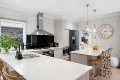  1B Orchard Grove Frankston South VIC 3199 $1,270,000 - $1,370,000 Featuring an elegant design rich in detail and impressive craftsmanship, this Olivers Hill home beautifully acknowledges its significant beachside setting with south-facing bay aspects and a seamless indoor-outdoor flow. Set within an exclusive neighbourhood where scenic walking paths lead directly to Frankston Beach, Sweetwater Creek Reserve, and Bayside Shopping Centre, it offers convenient access to public transport and local cafes. Creating a warm and inviting atmosphere, the generous open living and dining spaces extend beyond a stone-finished kitchen, equipped with a butler's pantry, 900mm cooking appliances, island bench, and a Blanco dishwasher, making it easy to enjoy good food and great company. The soft glow of a gas log fireplace envelops chilly evenings in warmth, while a spacious covered deck, complete with a built-in barbecue offers a delightful setting for year-round alfresco entertaining. Three bedrooms and three bathrooms highlight a dreamy master suite, where an impressive dressing room and stylish dual vanity ensuite, complement a dedicated study nook and private balcony. Finalising with a dedicated study with garden views, a powder room, and double garage with internal access, the home's added extras include gas ducted heating, evaporative cooling, and a ducted vacuum system. Holding a lucrative Frankston High School zone address, only moments from Mount Eliza Village, Toorak College, and Frankston Hospital. 