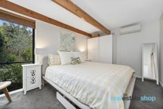  4 Cameron St Farrer ACT 2607 $1,320,000 Flexible viewing times – contact Natalie on 0405 313 901 to arrange a time to suit you. Bathed in natural light and brimming with character, this beautifully maintained mid-century Pettit and Sevitt masterpiece offers tranquility, style and functionality. Clerestory windows, skylights, exposed beams and parquetry flooring all create an inviting atmosphere, while the spacious single-level design effortlessly integrates indoor and outdoor spaces, offering a seamless connection to nature. Four well-sized bedrooms, each with a peaceful garden outlook, provide comfort for the whole family. In addition the stylish bathrooms enhance the home’s character. Outdoors, the manicured gardens offer a private sanctuary that complements the charm of this home. The impressive, low maintenance gardens have been thoughtfully designed by the owner, a horticulturist and professional landscaper, to provide the ideal retreat to entertain and relax. A sun-drenched front courtyard, framed by Gardenias and Magnolias, features stunning travertine pavers, perfect for enjoying your morning coffee amid lush greenery in a tranquil setting. At the rear, a covered alfresco deck area seamlessly extends from the living space, ideal for hosting guests while overlooking the beautiful backyard. The secure wrap around yard provides a safe space for children and pets, while two driveways offer ample room for a trailer, boat, or caravan. Plus, a herb garden runs along the side of the house—something for everyone to enjoy! Upon entering this secluded oasis you will immediately feel right at home! Positioned in a quiet, family-friendly neighbourhood, this unique home is just a short stroll from Farrer Shops, where you’ll find the local IGA and popular Fox and Bow Cafe. It’s also within walking distance to Farrer Primary School, parks, playgrounds and Farrer Ridge where you can enjoy scenic walking trails. Nearby, you’ll find local ovals, Southlands Shopping Centre and convenient transport links to ensure an easy commute to Woden, Tuggeranong and the City. Features: -Mid Century Pettit and Sevitt single level masterpiece -Positioned in tightly held street on a private block surrounded by charming gardens -Double garage with workshop space -Additional driveway providing space for a caravan, trailer and boat -Professionally landscaped, fully irrigated, low maintenance gardens -Front courtyard features LCD spotlights for evening entertainment -Sunny front courtyard featuring travertine pavers and established gardens -Light filled living enhanced by skylights, floor to ceiling and clerestory windows -Separate family room with new double glazed doors -Classic Parquetry flooring and new carpet through hub of the home -Exposed timber beams -Spacious kitchen with ample storage, bench space, dishwasher and electric appliances -Four bedrooms all with built in robes, three overlooking a rock garden featuring rosemary, Azaleas -and Crepe Myrtles. -Master with ensuite and view over front courtyard. -Stylish mid century bathrooms -Renovated powder room -Private deck off living with insulated pergola overlooking gardens -Garden shed with power -Herb garden with sage, thyme, oregano, Thai and sweet basil -Walking distance to Farrer Shops, Farrer Primary School, Farrer Ridge, local playgrounds, ovals and Southlands Shopping Centre.. 