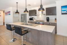  3 Bandon Loop Dunsborough WA 6281 $1,150,000 Welcome to your dream home at 3 Bandon Loop, Dunsborough! This modern 4-bedroom, 2-bathroom residence is perfectly situated on a generous 614 sqm block, with gated side access to the powered shed/workshop. As you step inside, you will be greeted by an open plan and inviting living room that seamlessly combines the living/kitchen/dining area, perfect for entertaining family and friends. The contemporary kitchen features a stylish island bench with stone benchtops, ideal for casual meals or meal prep, custom lighting and is equipped with top-of-the-line appliances and a walk-in pantry. The extra-sized master suite is a true retreat, complete with an ensuite bathroom with double vanity, bathtub and shower plus there’s a large walk-in robe. Three additional well-appointed bedrooms provide plenty of space for family or guests and have built-in robes, while the second bathroom also has a bathtub and offers convenience for busy mornings. Step outside to discover your own private oasis. The beautifully landscaped garden features vibrant vegetation, fruit trees and lawn, perfect for children to play or for hosting weekend barbecues. There’s also a rainwater tank for the gardens. Enjoy leisurely strolls along the nearby pathways or the local recreational parks and golf course are only a stone’s throw away. Enjoy the outdoor hot/cold shower when returning from the beach. Additional features of this remarkable home include: – Solar panels facing NE and NW for maximum exposure to the sun. – Ducted reverse cycle air conditioning throughout the house. – Heat pump hot water system. – Extra high double garage for secure parking and side storage area. – Central fireplace for winter with ducted heat vents to bedrooms. – Ample natural light from the north facing aspect of the lounge and alfresco areas creating a warm and inviting atmosphere. – Proximity to local amenities, golf club, schools and the stunning Dunsborough region. Don’t miss your chance to own this exceptional property in one of Dunsborough’s most sought-after neighbourhoods. Whether you’re looking for a family home or a stylish retreat, 3 Bandon Loop is the perfect place to call home. Contact Joe today to arrange a private viewing and experience the charm of this outstanding property for yourself. Joe Jordanoff – 0498 935 086 or email joej@jmwrealestate.com.au 