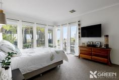  11 Mippi Rd Halls Head WA 6210 $2,400,000 Darren Ahearn and Emma Hutton are proud to present 11 Mippi Road, Halls Head-a premium Madison home, perched high in the sky and surrounded by breathtaking ocean views. This impressive four bedroom, four bathroom and a four car garage is set on an expansive 1,408 sqm elevated block. A stylish and secluded residence like this must be seen to be believed; but be warned, a visit will forever raise your expectations of what property can achieve. Step inside the exceptional indoor-outdoor living space, where a show stopping pool seamlessly blends with breathtaking ocean views. A stylish tiled seating area and lush greenery create a resort-like ambiance. Through the double glazed, double bi-fold doors, soaring ceilings and sleek porcelain tiling set the stage for luxurious living. The stunning kitchen and scullery feature premium engineered stone benchtops, a waterfall-edge island with a built-in mini fridge, and a five burner top gas cooktop, all with ocean views. Both the living and dining areas open onto the expansive balcony, offering uninterrupted coastal vistas. As you walk down the extra width hallway, glass plantation louvers let in natural light and offer a clear view of the stunning pool and established easy-care tropical garden. The master bedroom boasts a spacious hallway and an open ensuite design featuring a double floating basin, full width vanity with LED mirror lighting. This stunning room benefits from exceptional design prowess; the orientation offers both sanctuary and stunning views of the outdoor area, pool and ocean. Guests or residences to the rest of the home will also feel like they are on holiday, with two of the three family bedrooms complemented by their own modern ensuites and one enjoying convenient access to the main stylish bathroom. Furthermore, two of the bedrooms offer stunning ocean views. The ensuites are sleek and contemporary, each featuring a shower and toilet. The main bathroom is beautifully designed with a bath, shower, and striking grey tiling throughout. The expansive four-car garage is a car enthusiast’s dream and is fitted with durable two pack flooring, dual high roof auto garage doors, plus a sauna for added luxury. In addition, the rear of the property contains an impressive double brick extra height powered workshop. This building has been designed with the potential to be a habitable residence in the future, with some further adaptation. This ancillary building has drive through access with an extra wide and extra width commercial roller door to allow access for all the toys. Features: – 1,408 sqm elevated block – Infinity style pool – Ocean views – Large powered workshop – Ducted reverse cycle air conditioner – 4 car garage with sauna – 4 bedrooms, 4 bathrooms – Under house storage – Double glazed windows This exceptional property has a unique bespoke design, with unprecedented views and high end finishings. This home exudes earthed ambiance with modern luxury flare. You must see this home in person to truly appreciate what is on offer here -without a doubt, a once-in-a-lifetime opportunity. Don’t miss your chance to make 11 Mippi Road Halls Head your new home. 